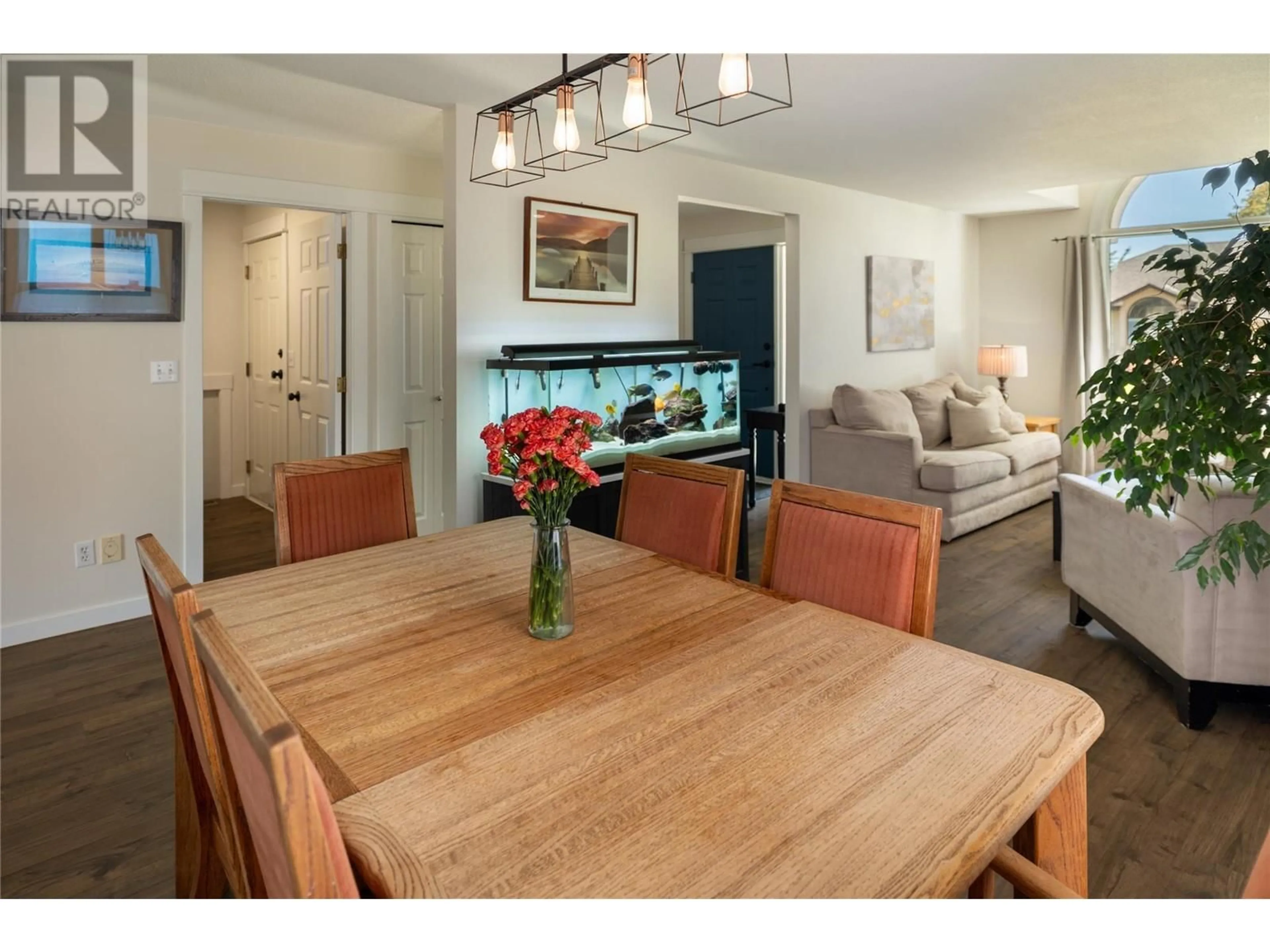 Dining room, wood/laminate floor for 1864 PORTLAND PLACE, Kelowna British Columbia V1V1P9