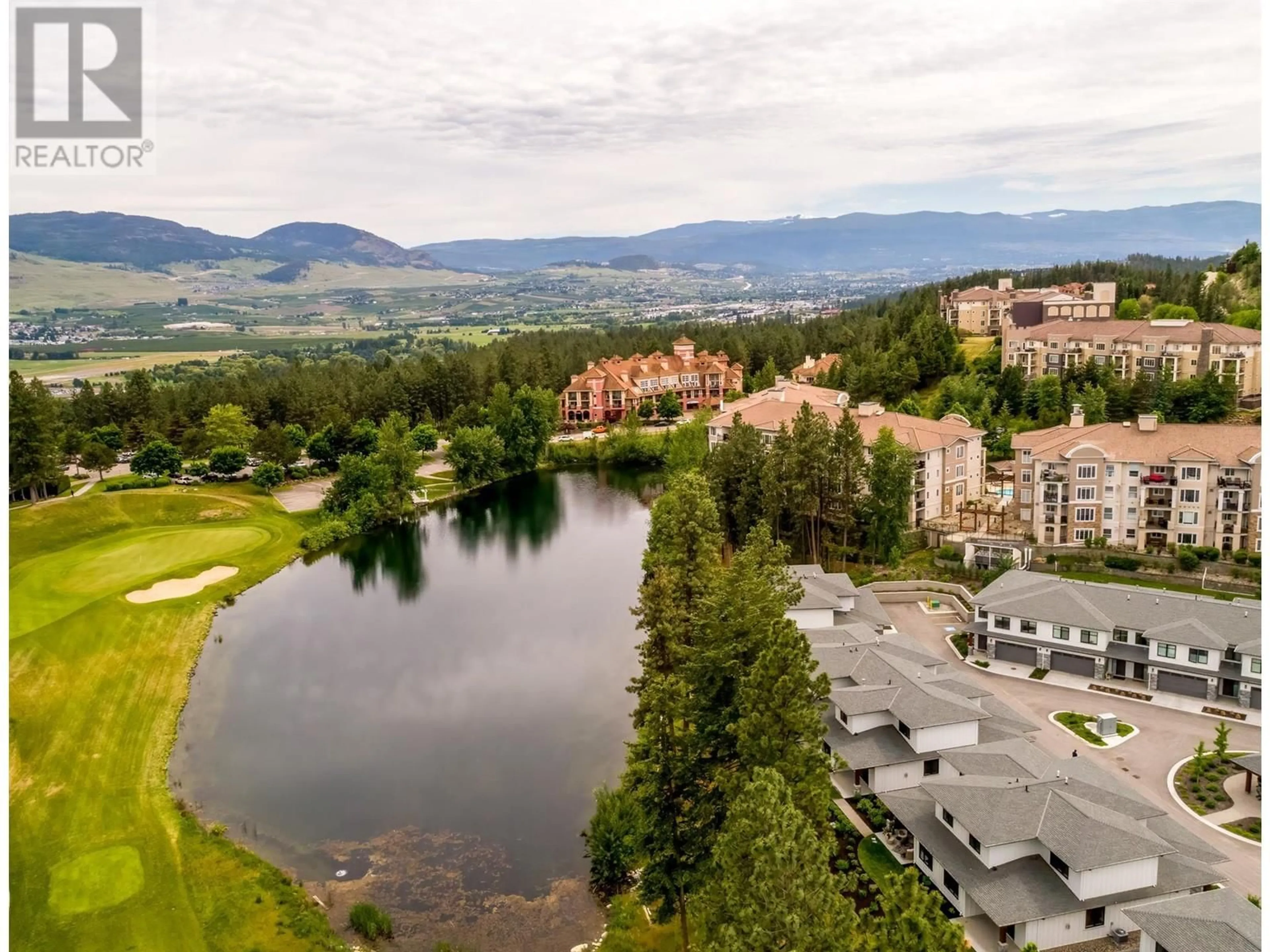 A pic from outside/outdoor area/front of a property/back of a property/a pic from drone, water/lake/river/ocean view for 14 - 1979 COUNTRY CLUB DRIVE, Kelowna British Columbia V1V0H6
