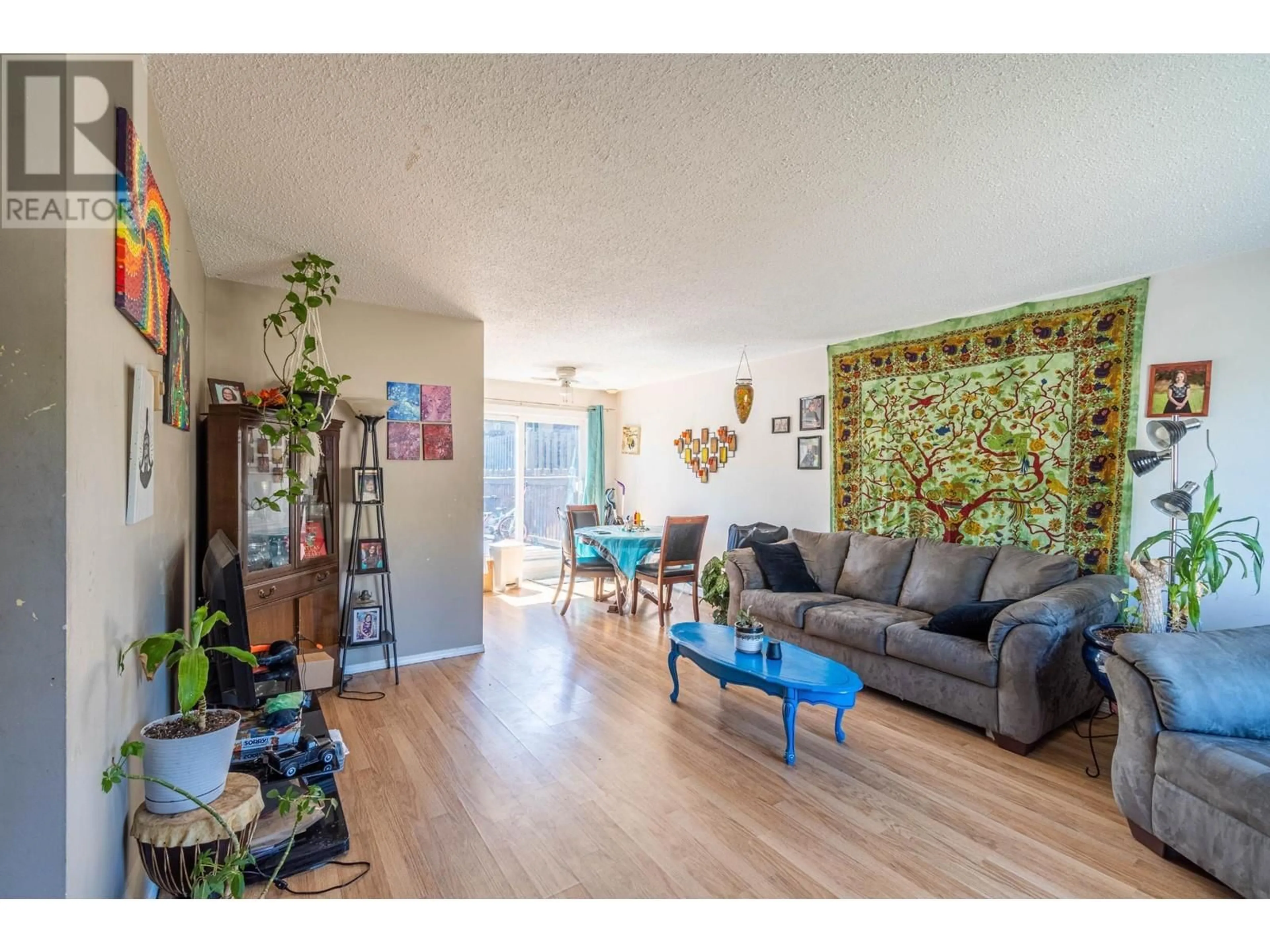Living room with furniture, wood/laminate floor for 9 - 1605 SUMMIT DRIVE, Kamloops British Columbia V2E2A5