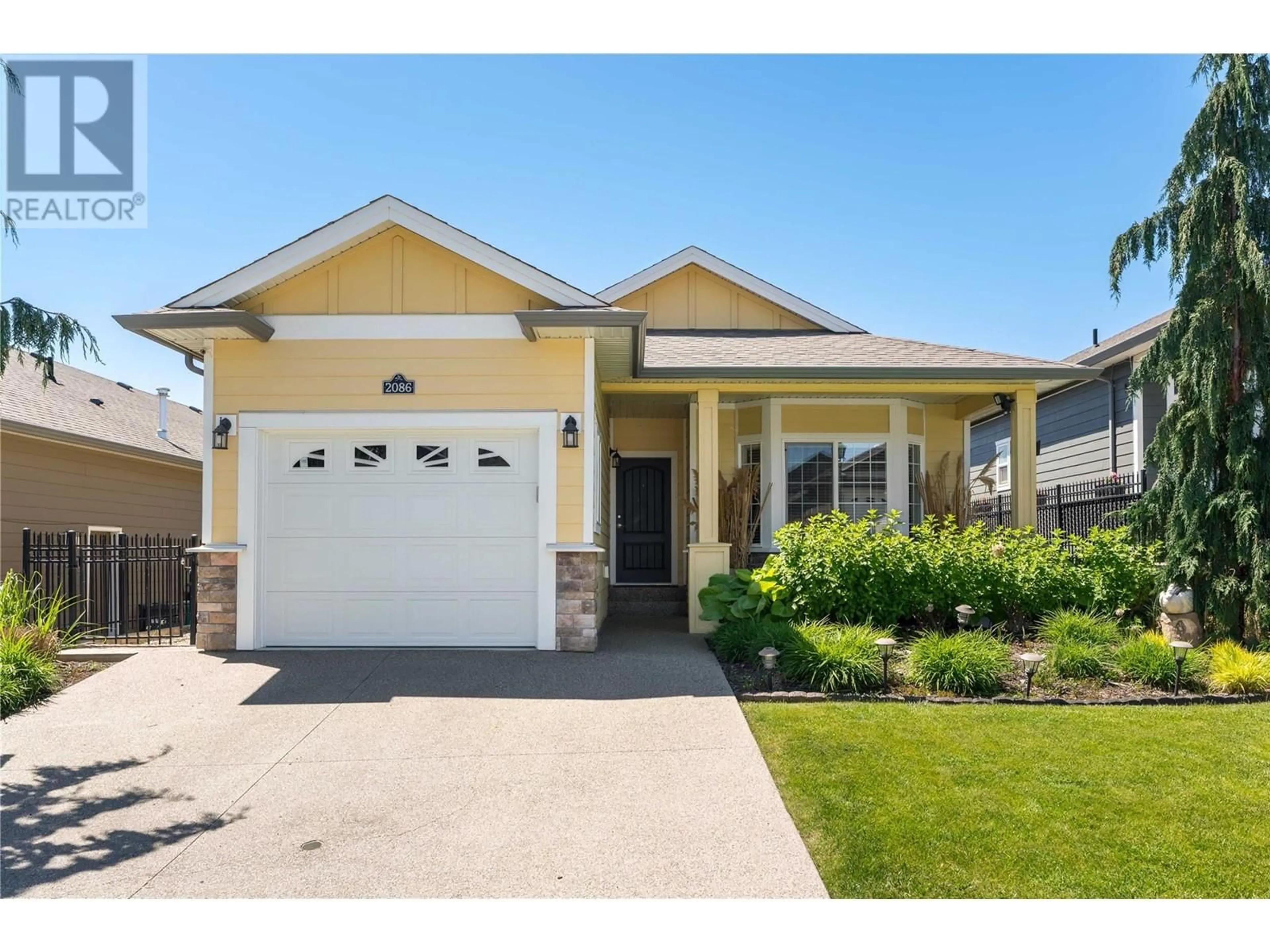 Home with vinyl exterior material, street for 2086 CLOVER DRIVE, Westbank British Columbia V4T3A5