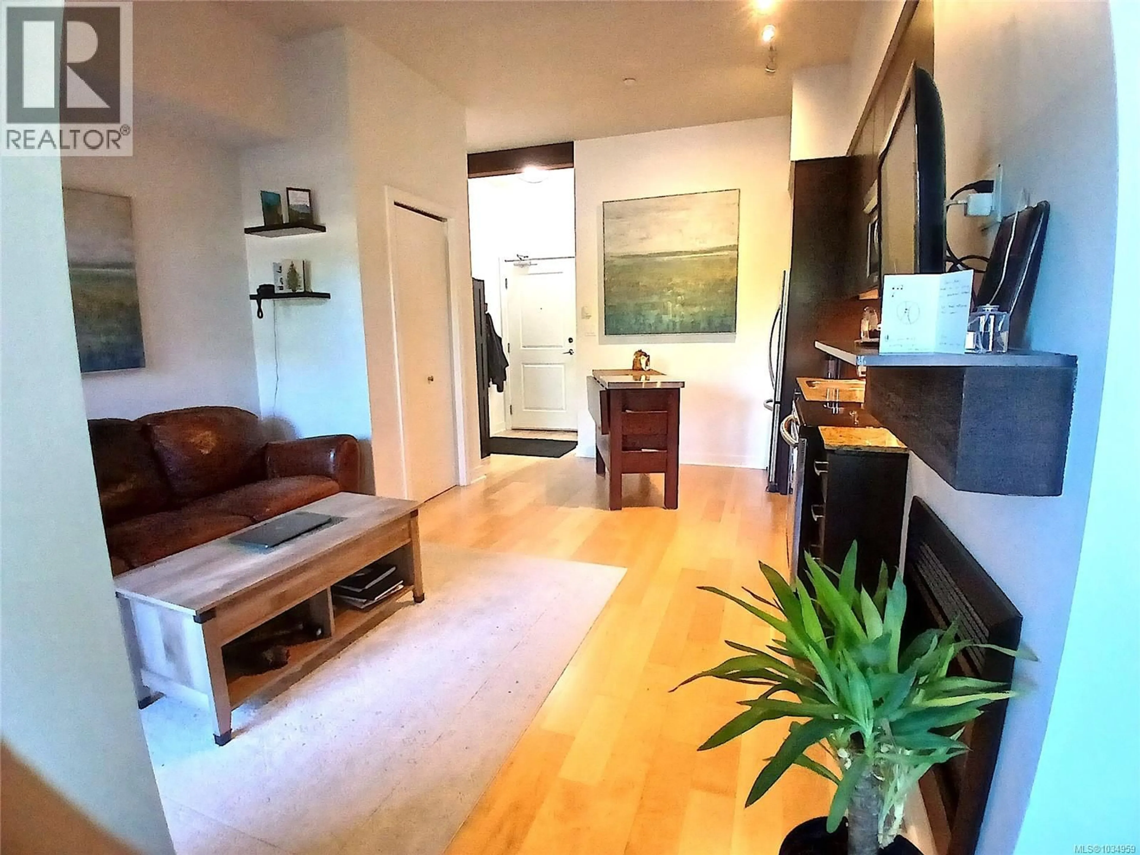 Living room with furniture, wood/laminate floor for 119 - 1395 BEAR MOUNTAIN PARKWAY, Langford British Columbia V9B0E1