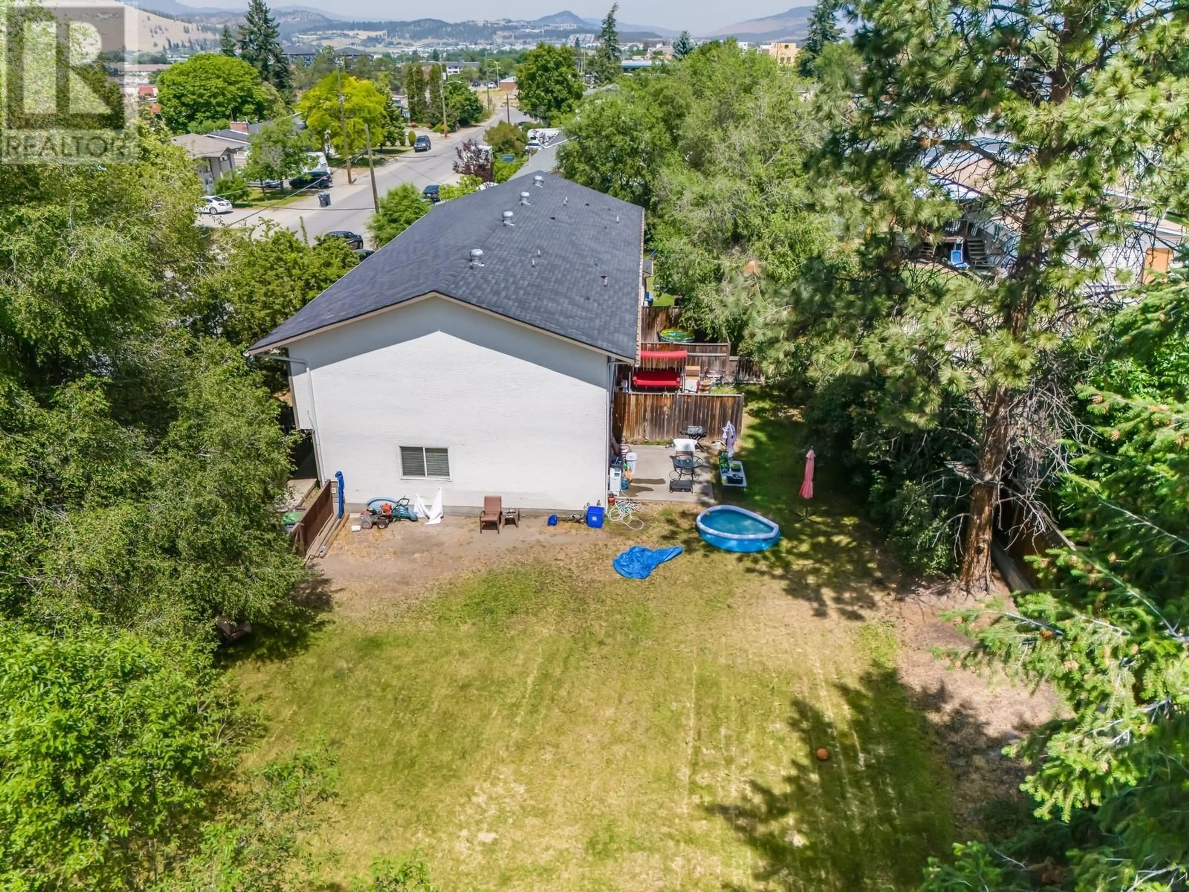 A pic from outside/outdoor area/front of a property/back of a property/a pic from drone, mountain view for 410 HOLBROOK ROAD WEST, Kelowna British Columbia V1X1S3