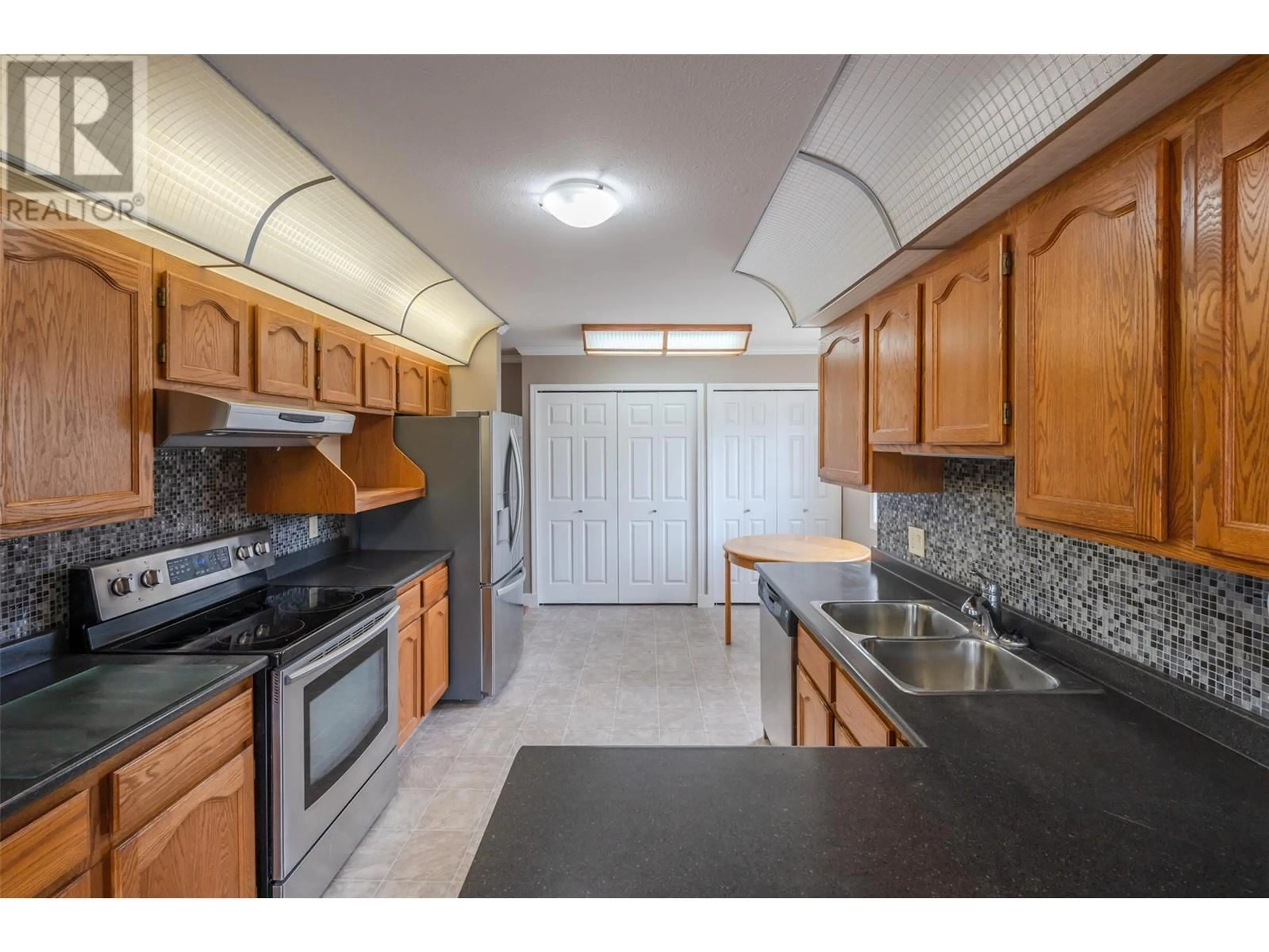 Standard kitchen, ceramic/tile floor for 201 - 157 GREEN AVENUE WEST, Penticton British Columbia V2A3S9