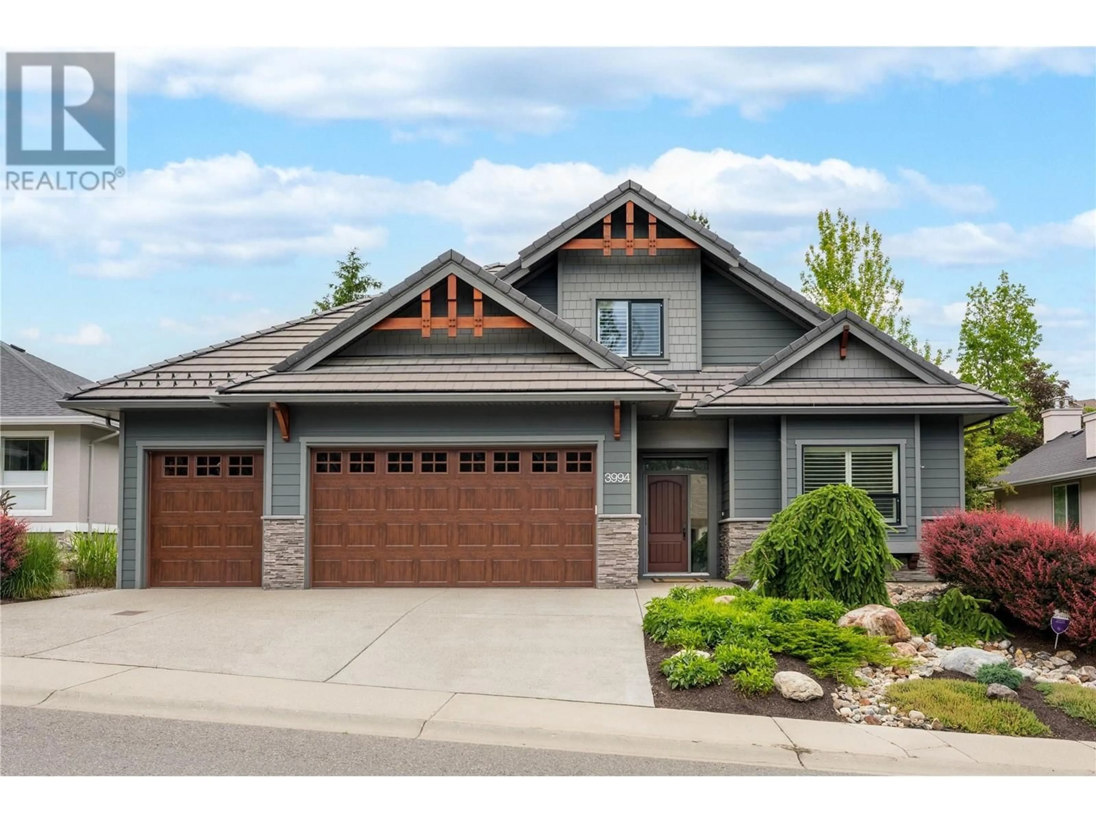 Home with brick exterior material, street for 3994 GALLAGHERS CIRCLE, Kelowna British Columbia V1W3Z9