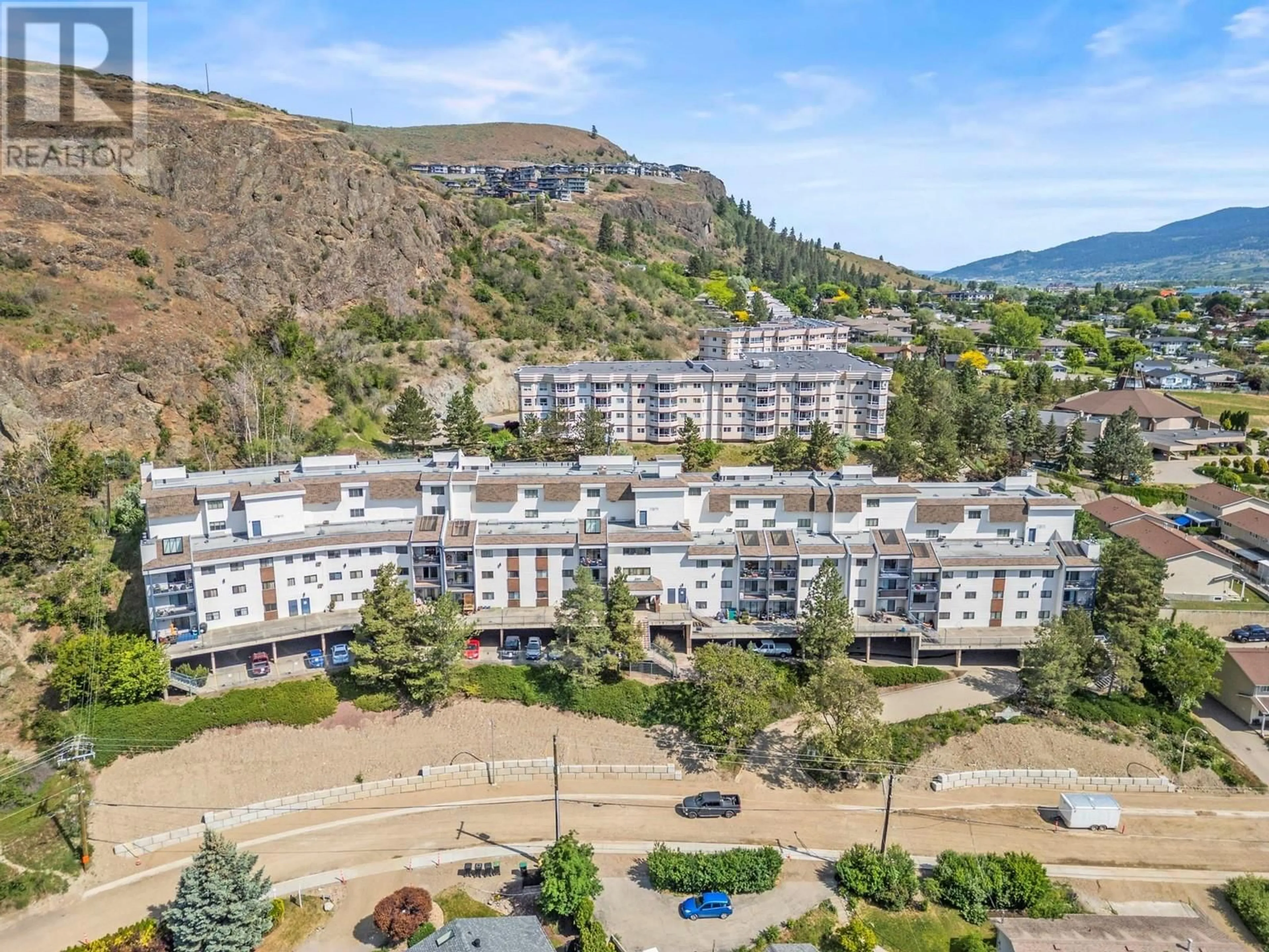 A pic from outside/outdoor area/front of a property/back of a property/a pic from drone, mountain view for 303 - 3901 32 AVENUE, Vernon British Columbia V1T8M3