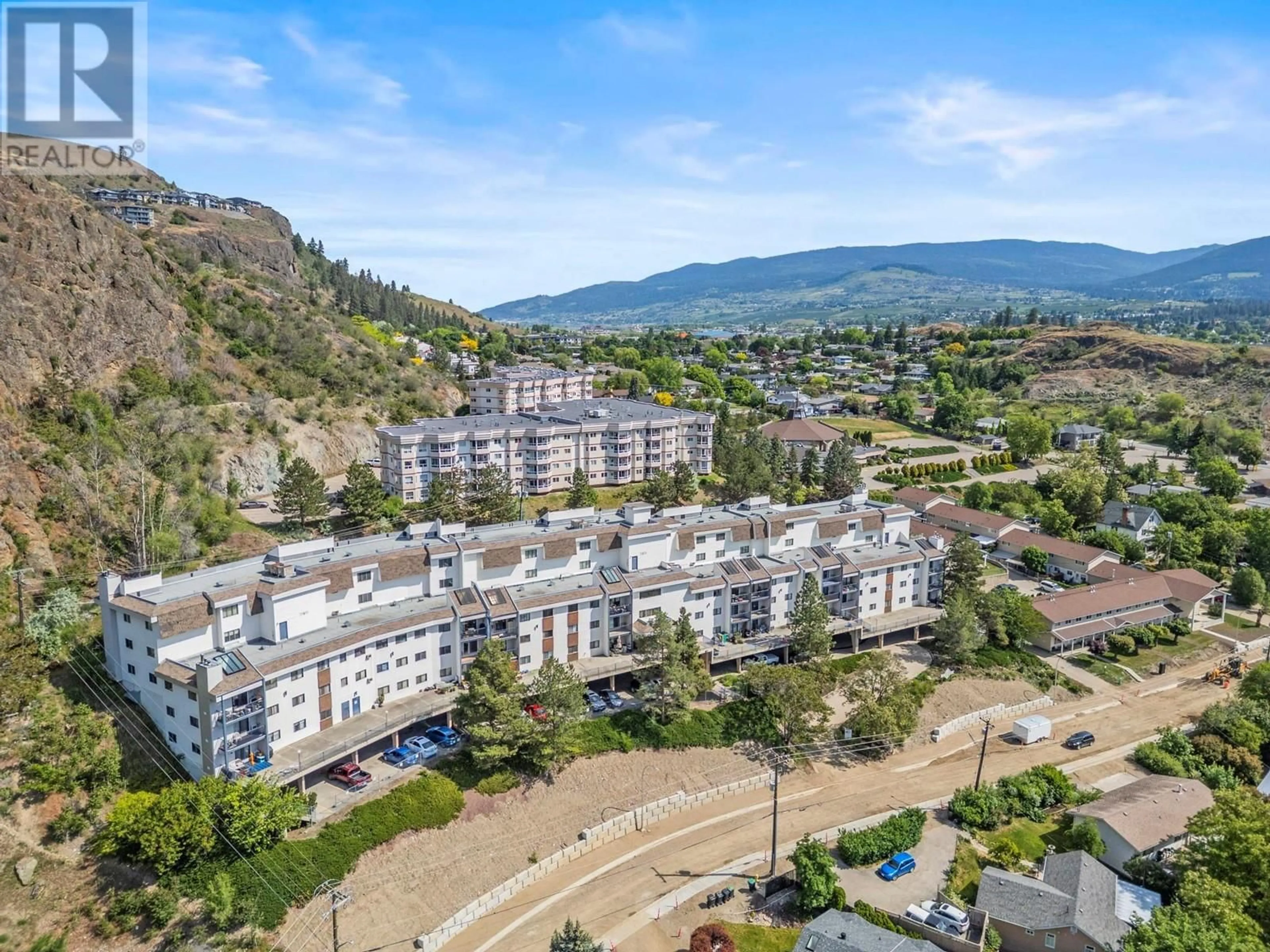 A pic from outside/outdoor area/front of a property/back of a property/a pic from drone, mountain view for 303 - 3901 32 AVENUE, Vernon British Columbia V1T8M3