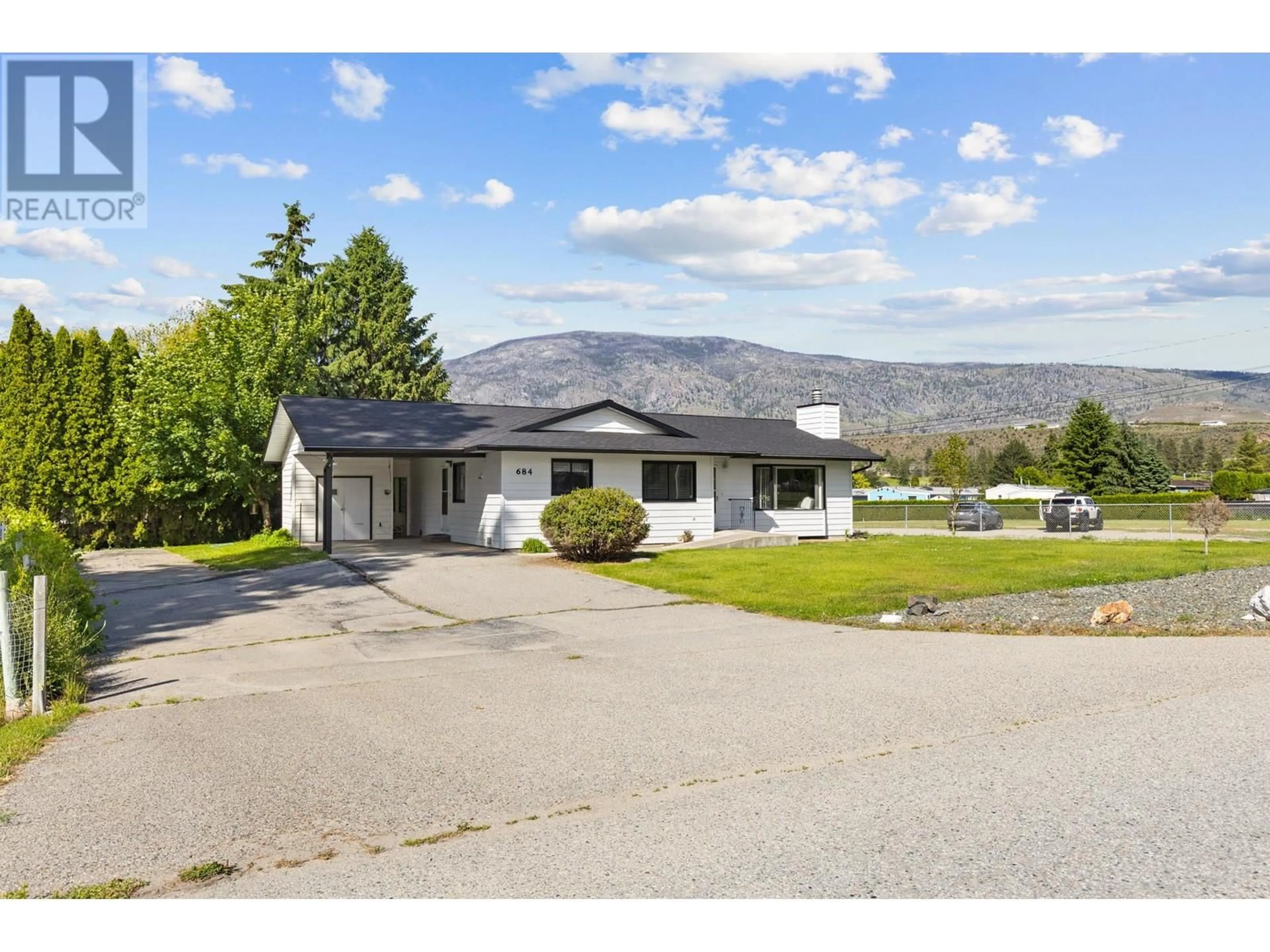 A pic from outside/outdoor area/front of a property/back of a property/a pic from drone, mountain view for 684 MERLOT AVENUE, Oliver British Columbia V0H1T4