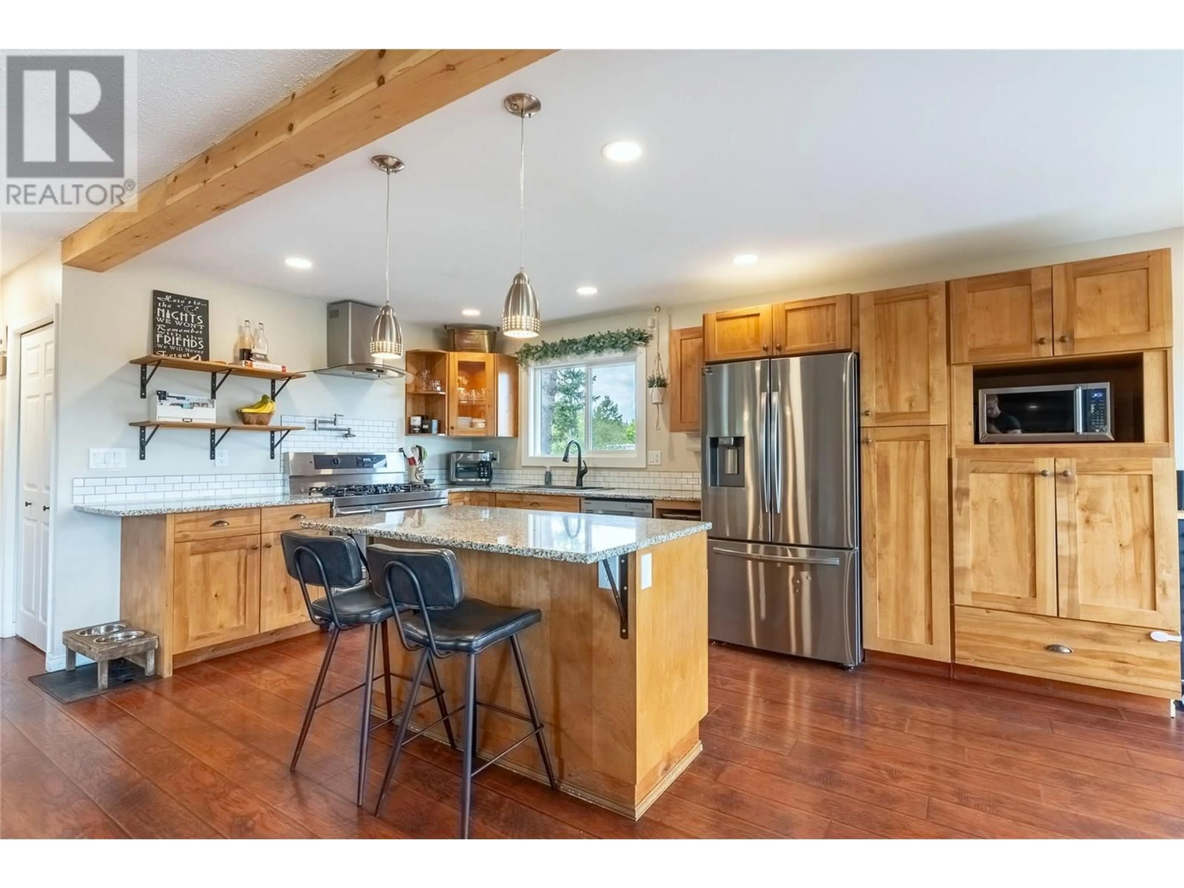 Open concept kitchen, wood/laminate floor for 6033 PRINGLE ROAD, Kamloops British Columbia V2C5V4