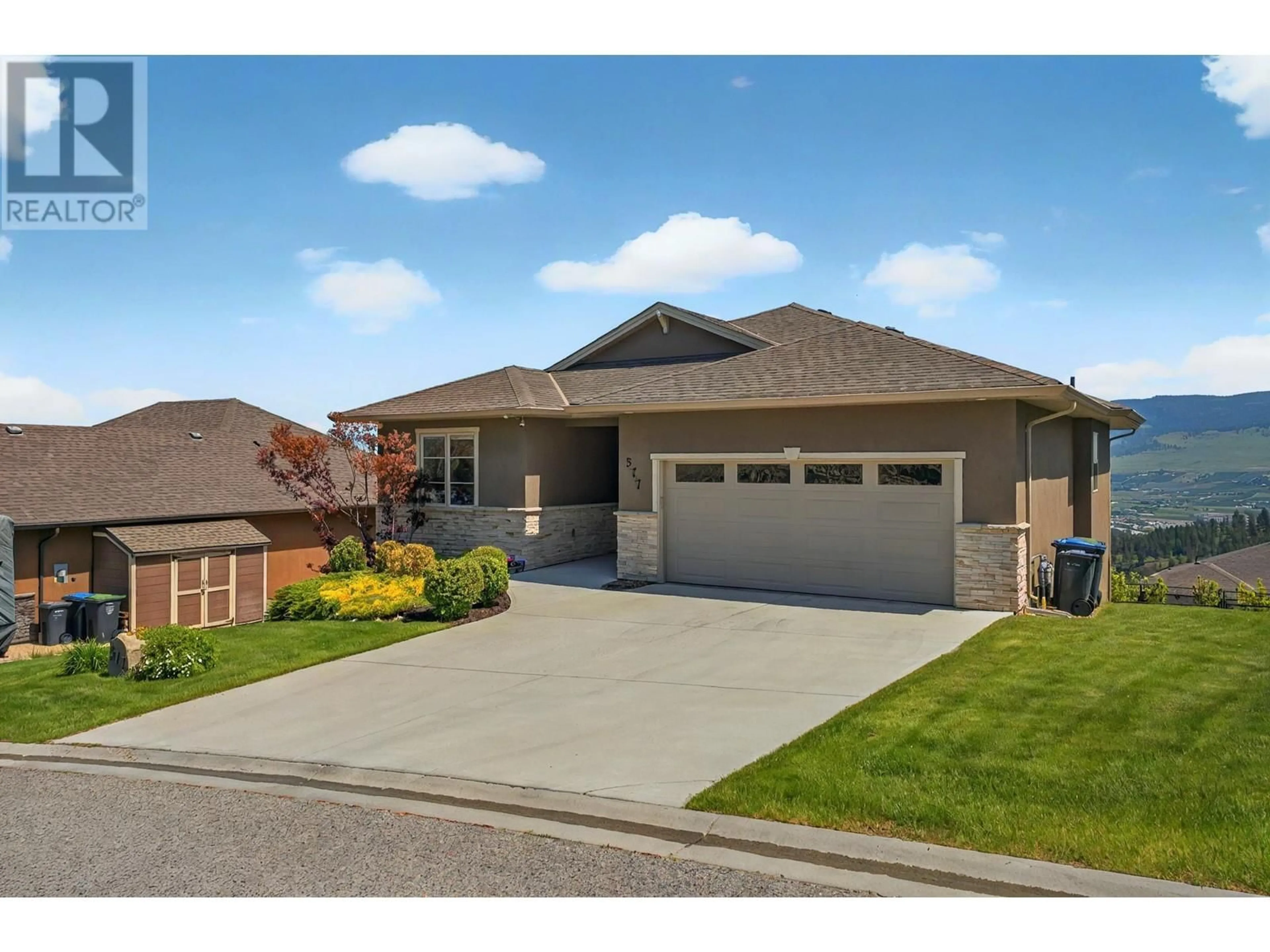 Home with brick exterior material, street for 577 HARROGATE LANE, Kelowna British Columbia V1V3A5