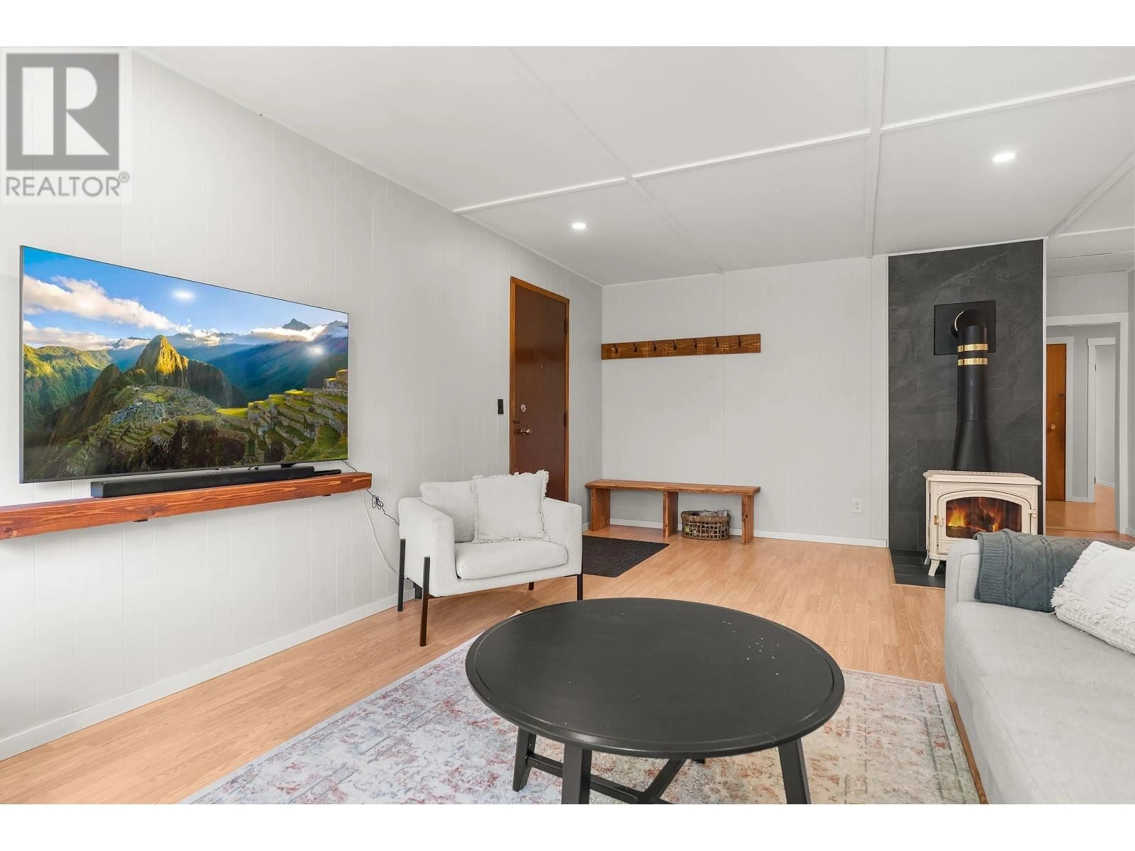 Living room with furniture, wood/laminate floor for 169 SPRINGBEND ROAD, Enderby British Columbia V0E1V3