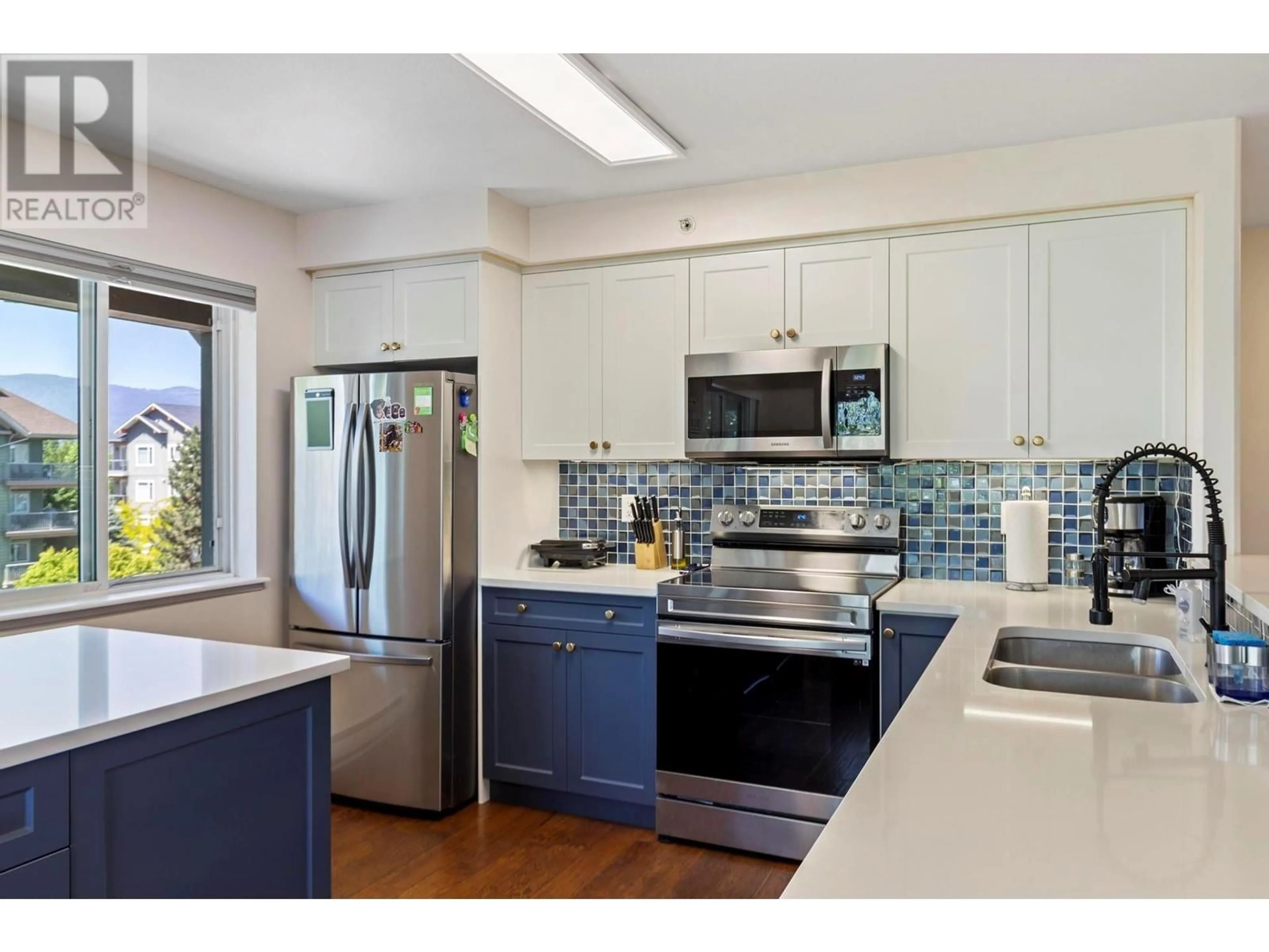 Open concept kitchen, ceramic/tile floor for 403 - 686 LEQUIME ROAD, Kelowna British Columbia V1W1A4