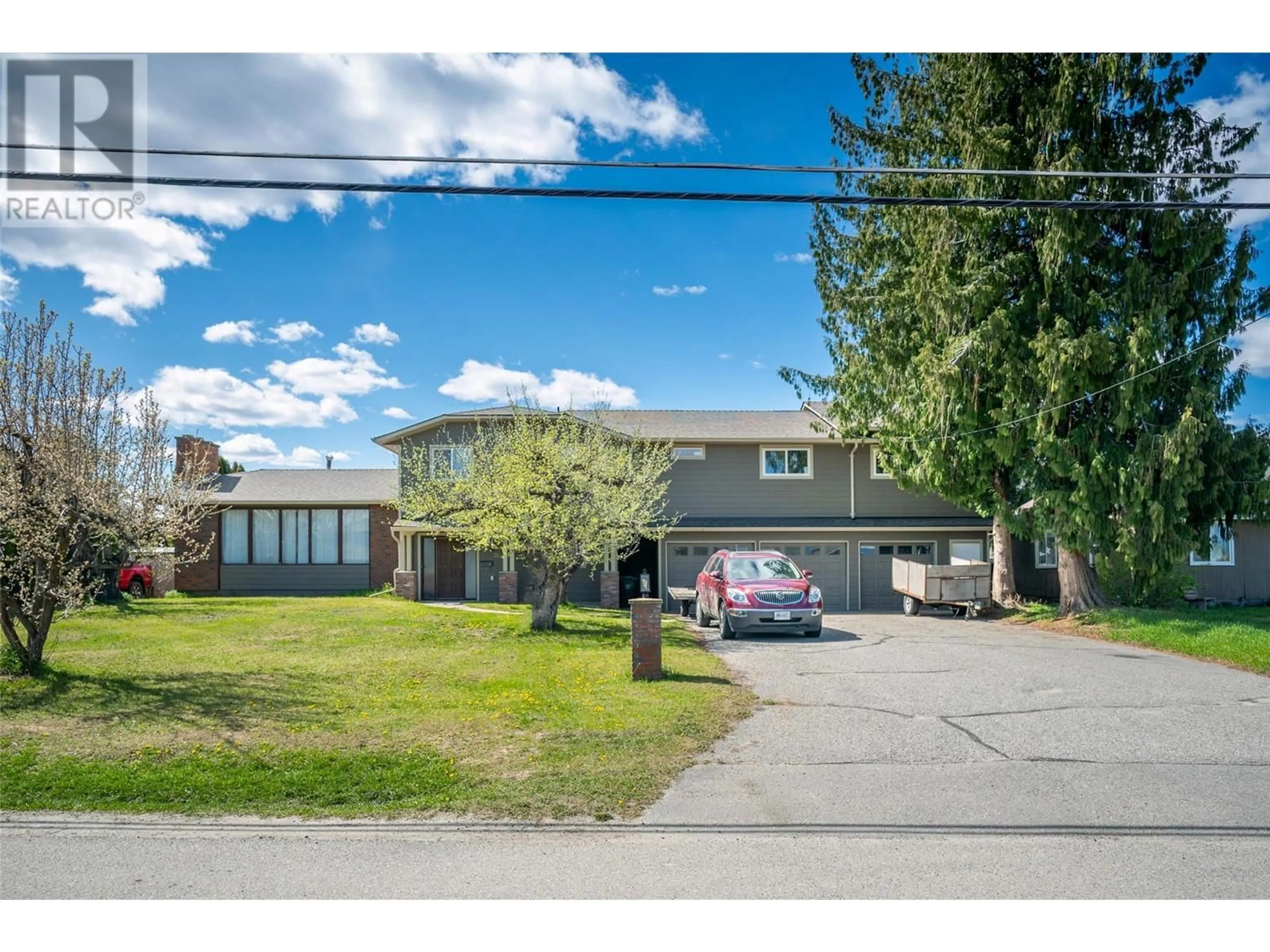 A pic from outside/outdoor area/front of a property/back of a property/a pic from drone, street for 2308 THACKER DRIVE, West Kelowna British Columbia V1Z1V7