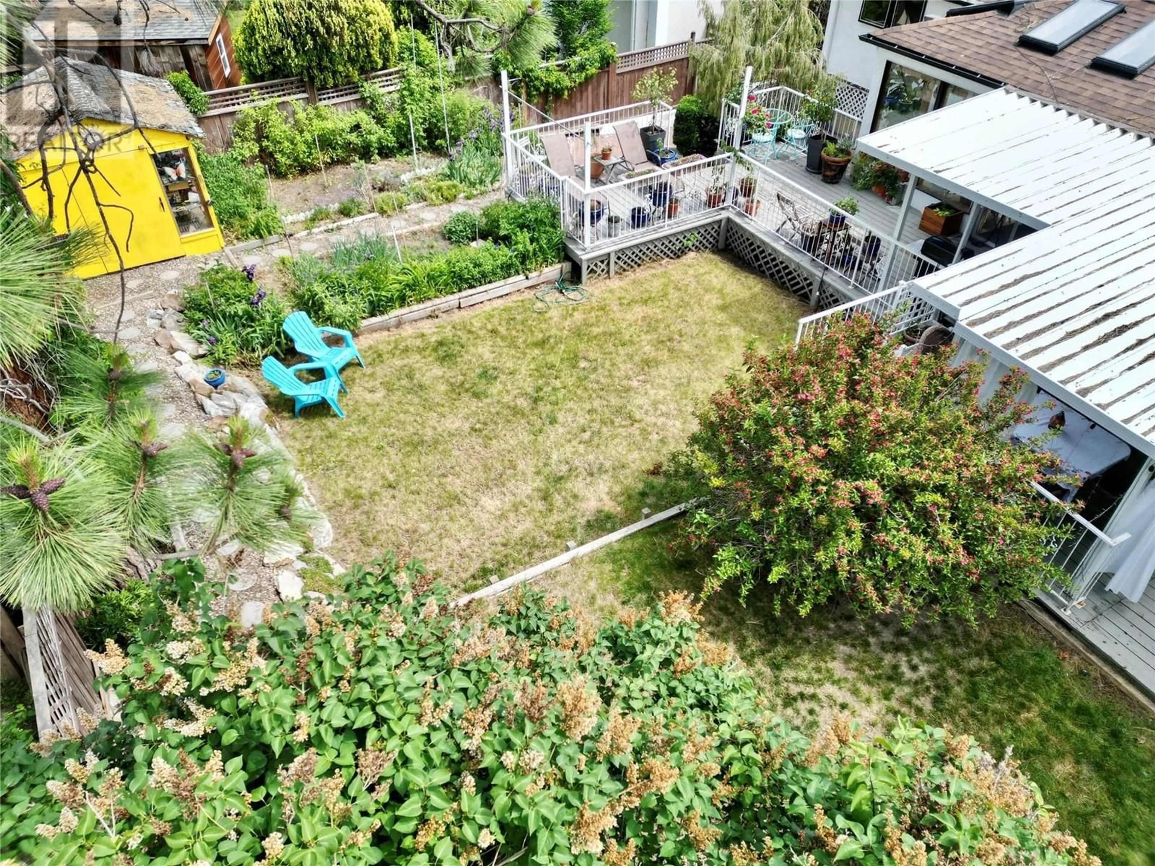 A pic from outside/outdoor area/front of a property/back of a property/a pic from drone, street for 36 CARAMILLO ROAD, Kelowna British Columbia V1V1B3