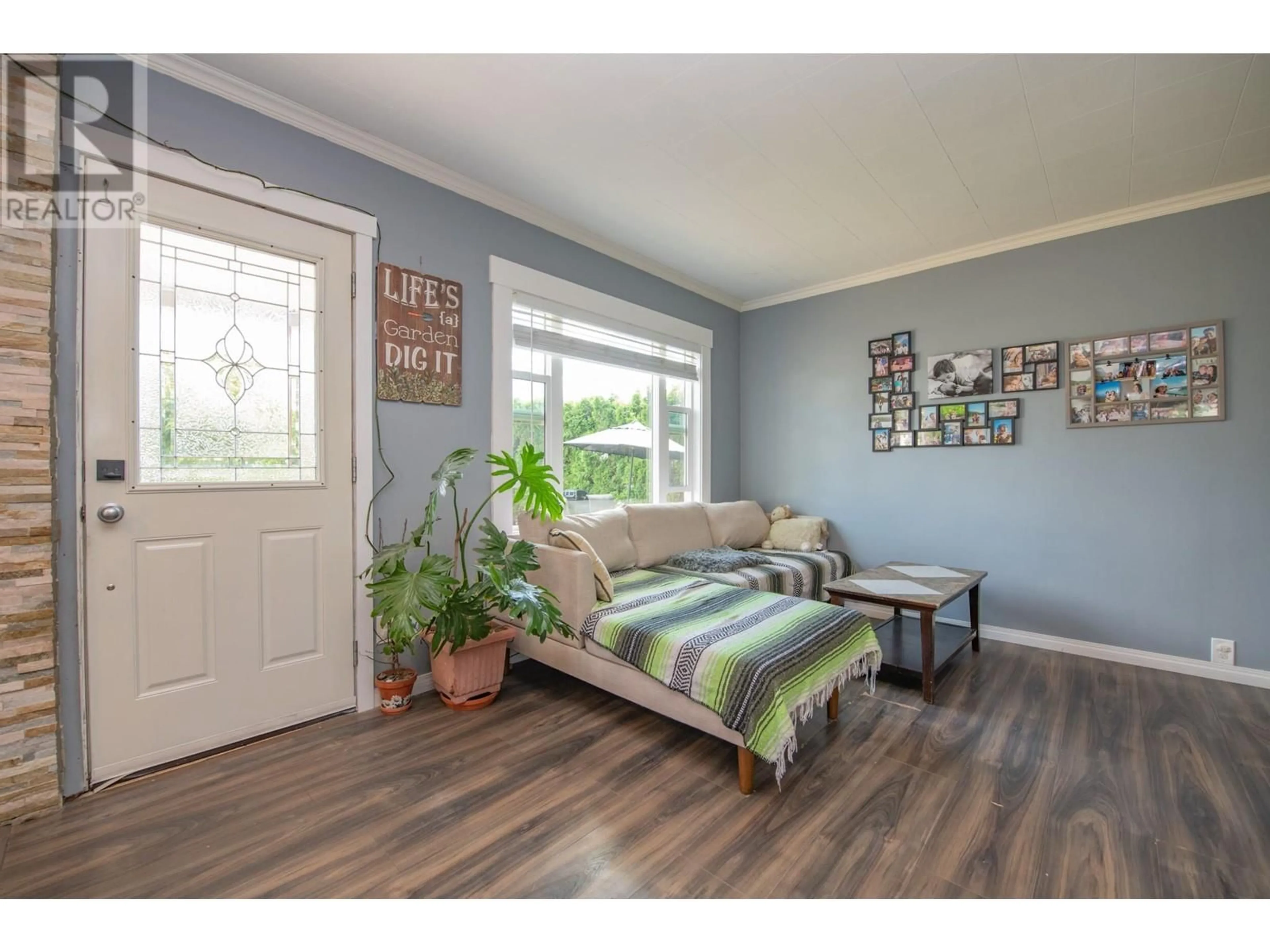 Living room with furniture, wood/laminate floor for 405 BAIRD AVENUE, Enderby British Columbia V0E1V2