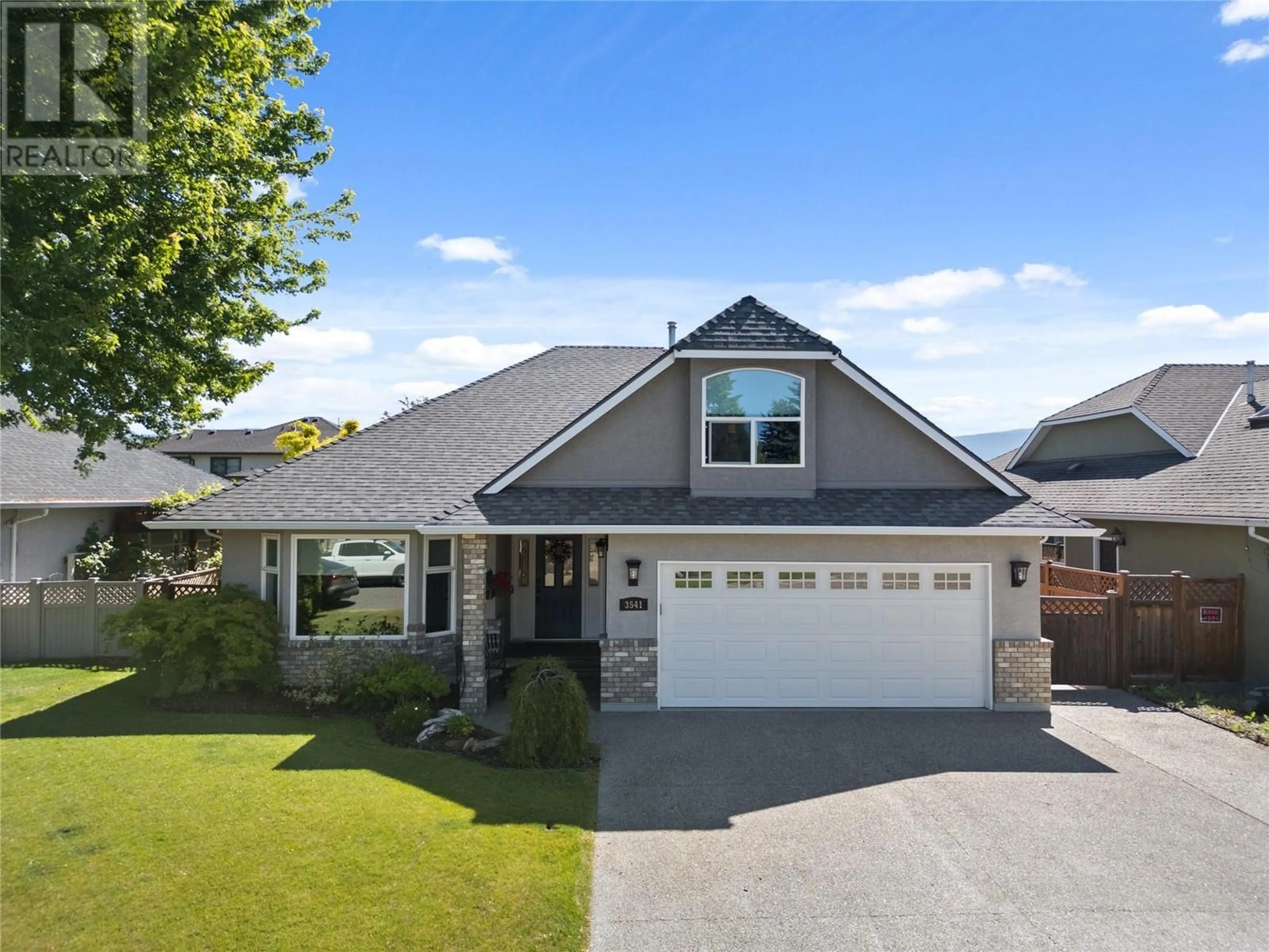 Home with vinyl exterior material, street for 3541 ATHALMER ROAD, Kelowna British Columbia V1W3Y5