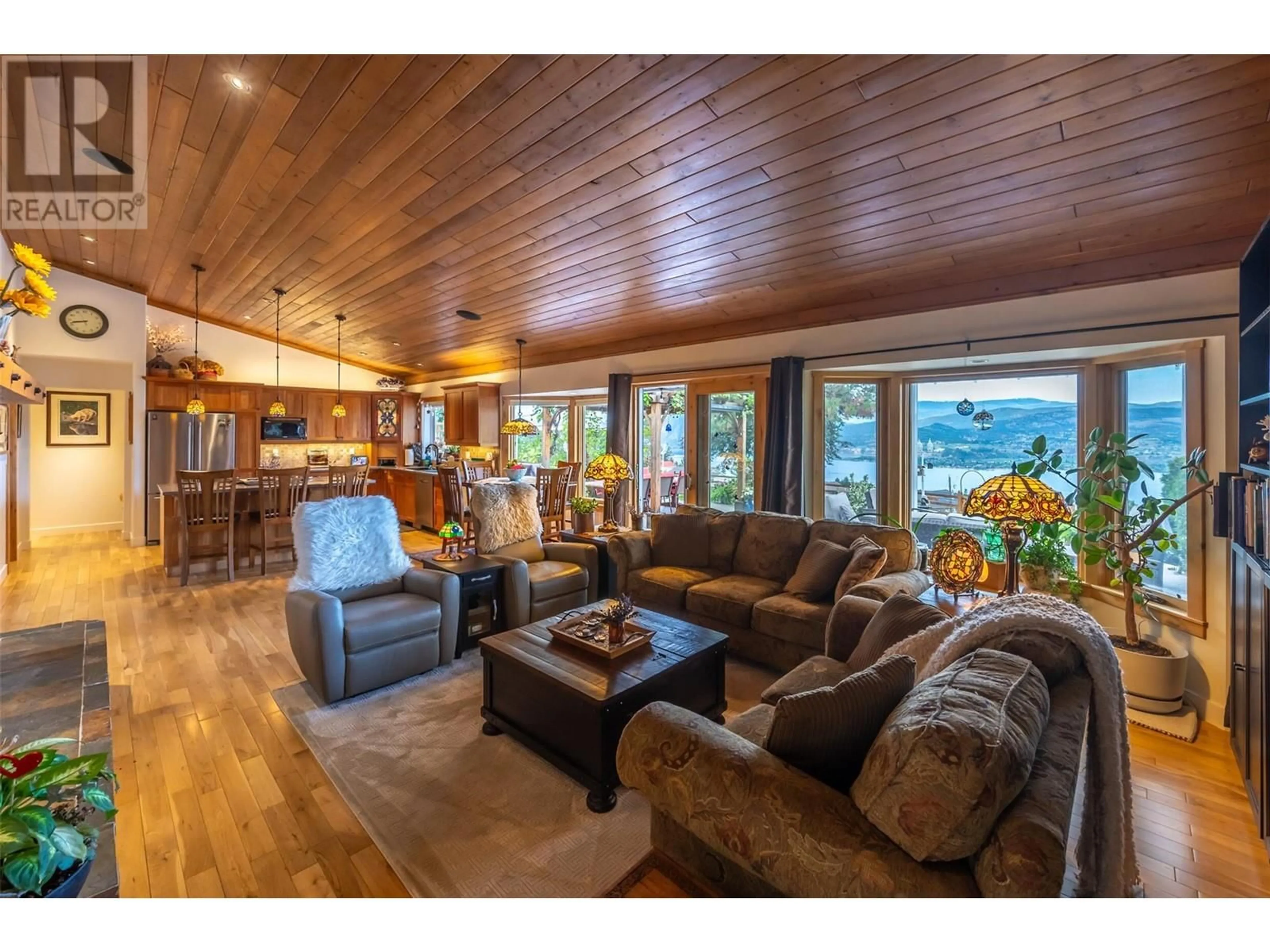 Living room with furniture, wood/laminate floor for 2839 ARAWANA PLACE, Naramata British Columbia V0H1N1