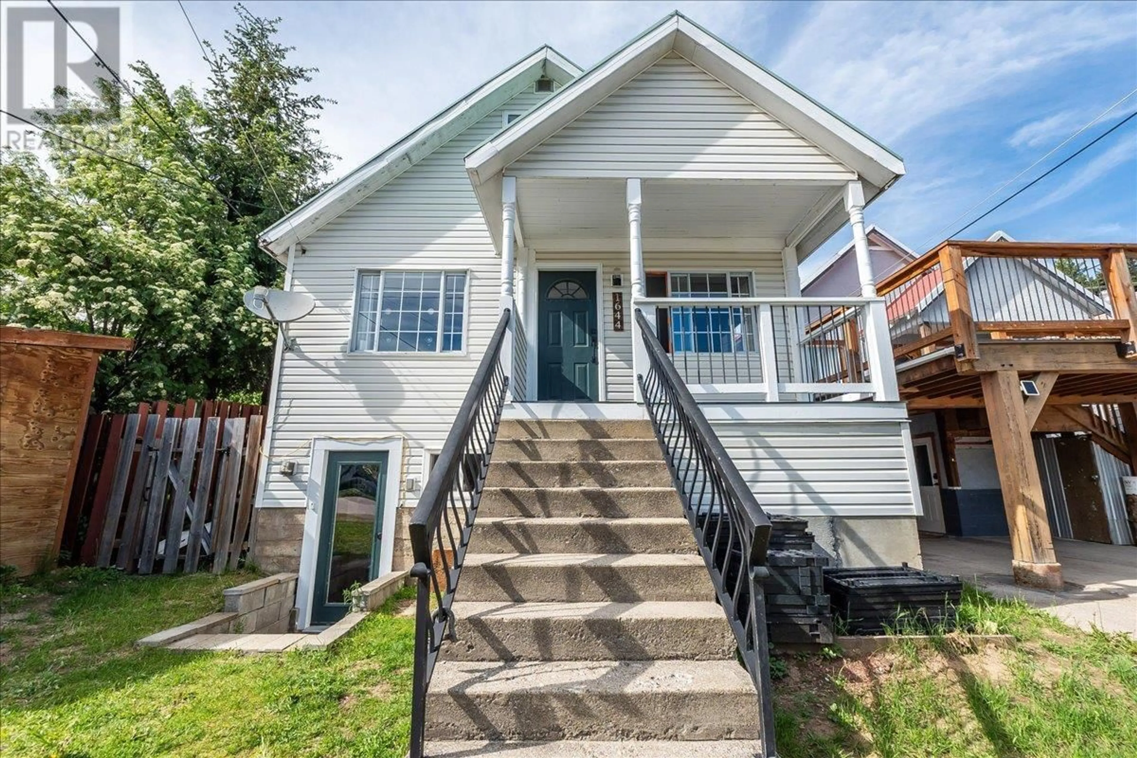 Home with vinyl exterior material, street for 1644 LEROI AVENUE, Rossland British Columbia V0G1Y0