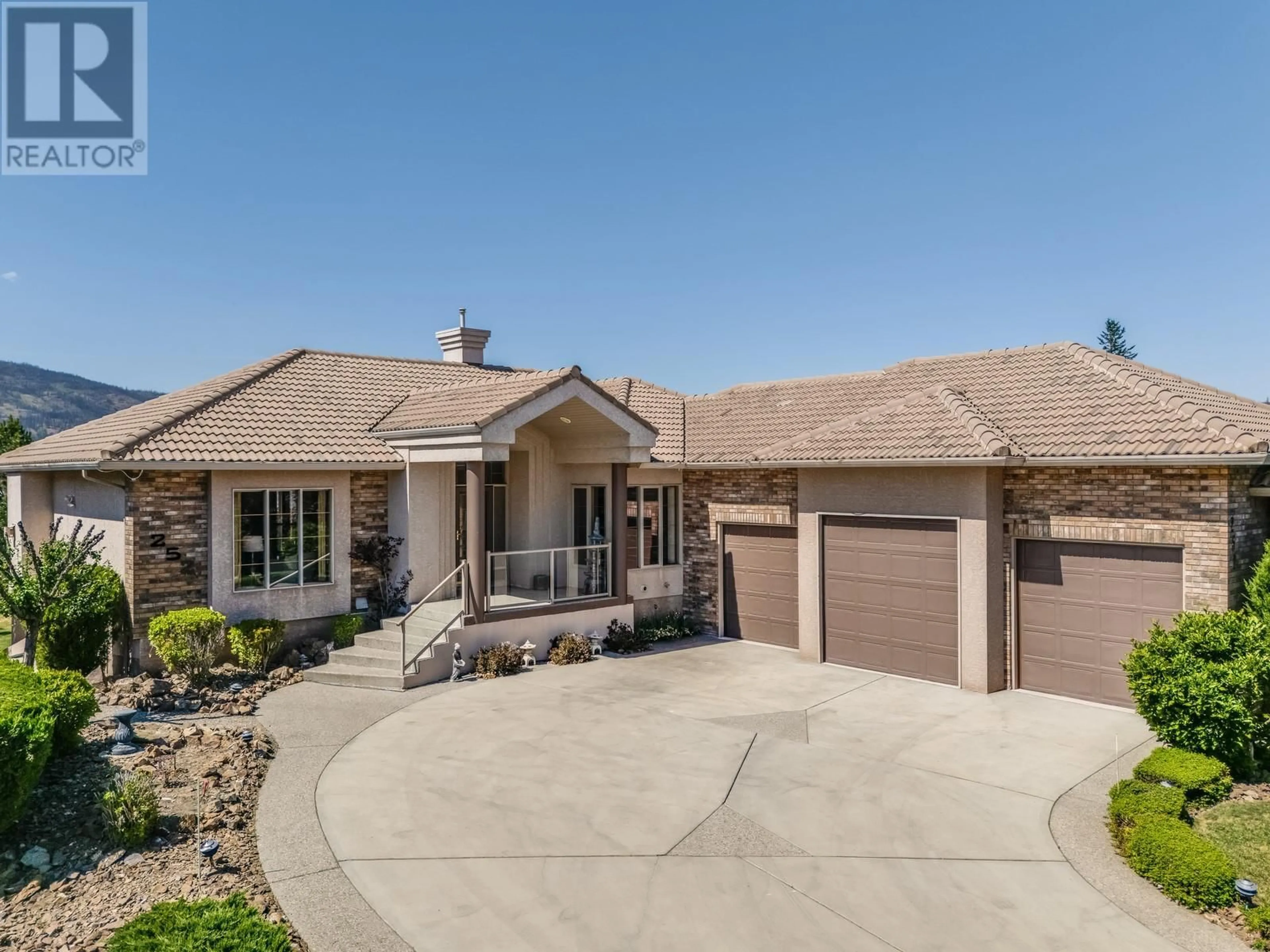 Home with brick exterior material, street for 252 CAMELOT COURT, Kelowna British Columbia V1V1N2