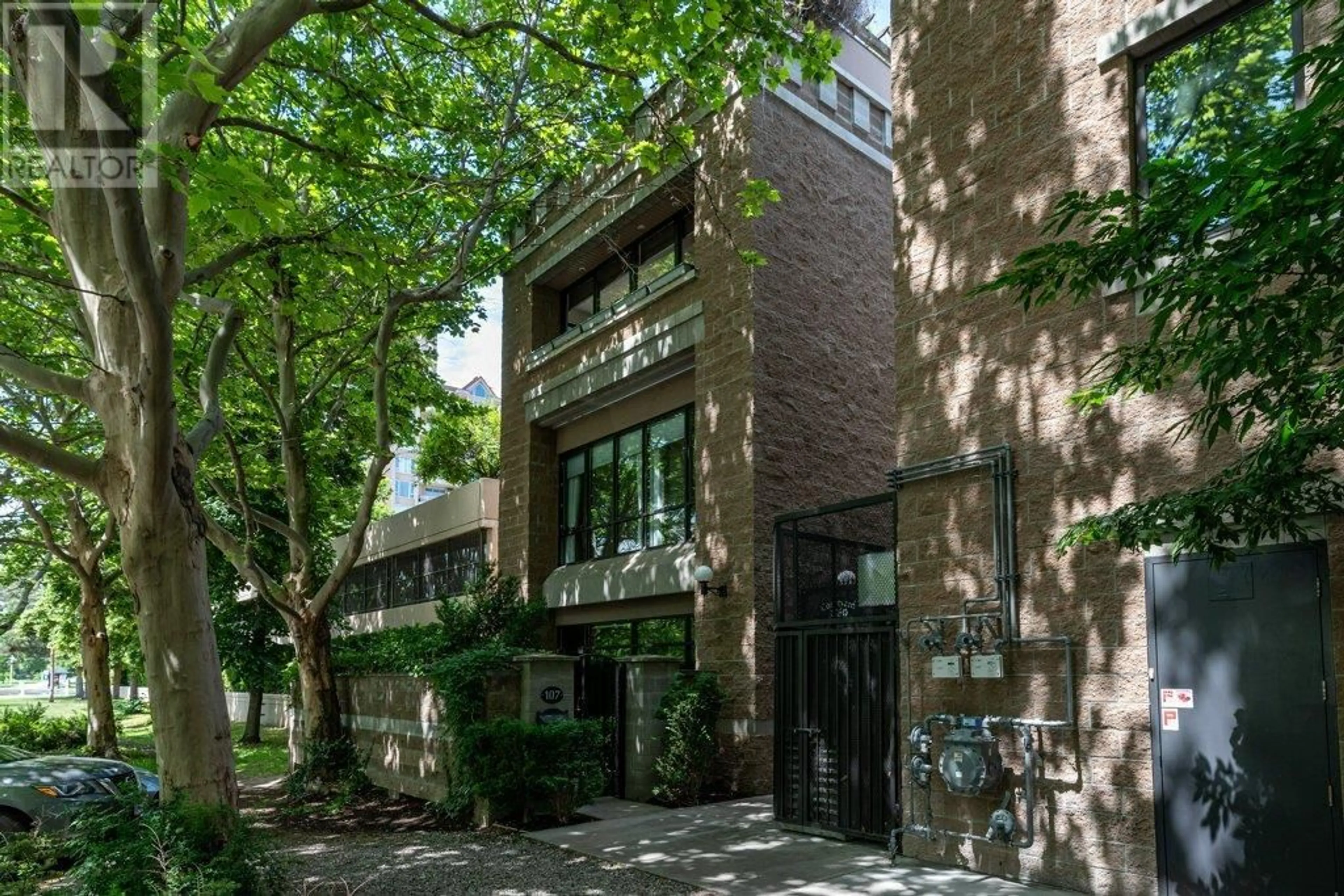 Home with brick exterior material, street for 107/207 - 1180 SUNSET DRIVE, Kelowna British Columbia V1Y9W6