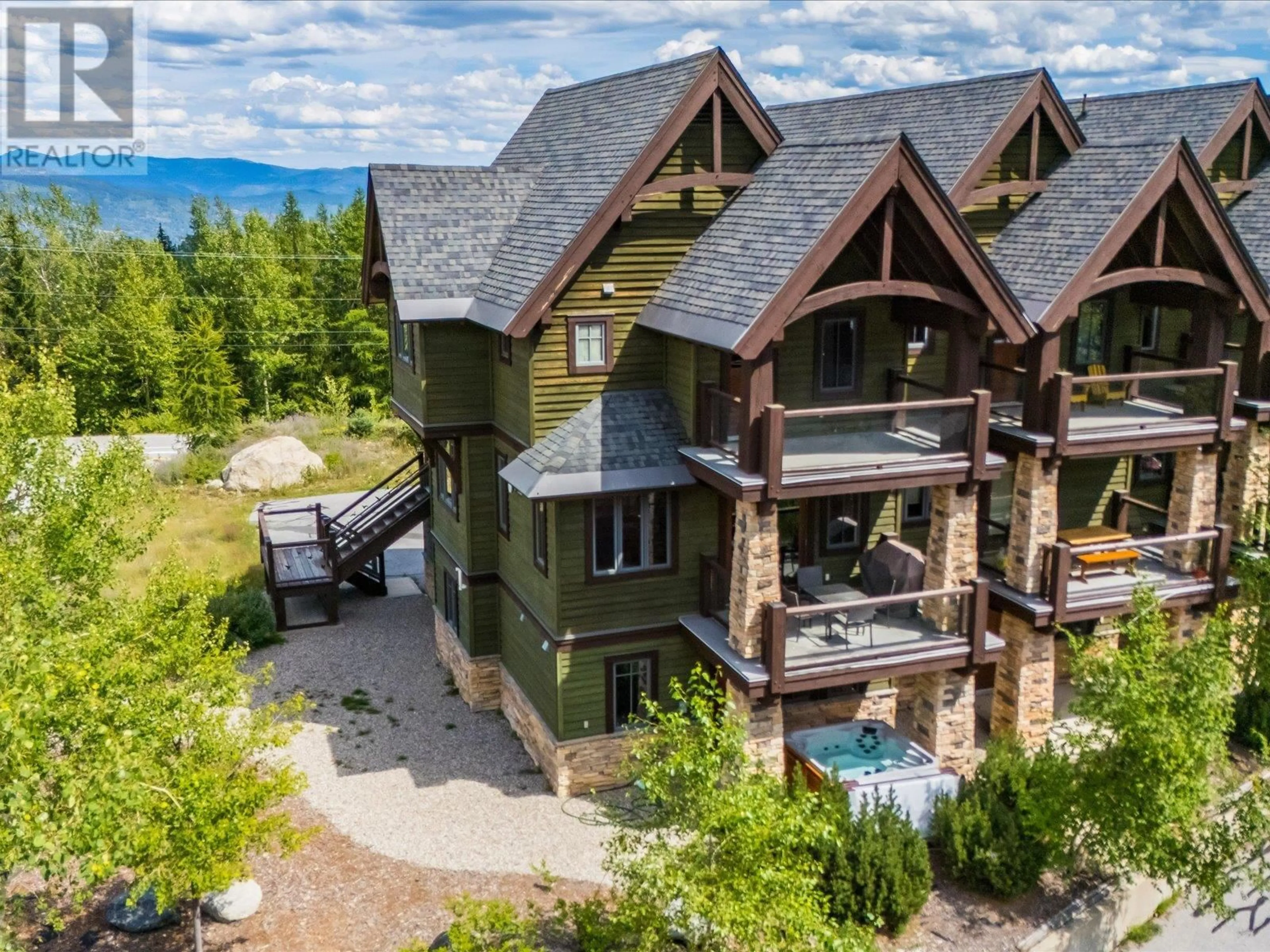 A pic from outside/outdoor area/front of a property/back of a property/a pic from drone, mountain view for A - 1002 CREEKSIDE TERRACE, Rossland British Columbia V0G1Y0