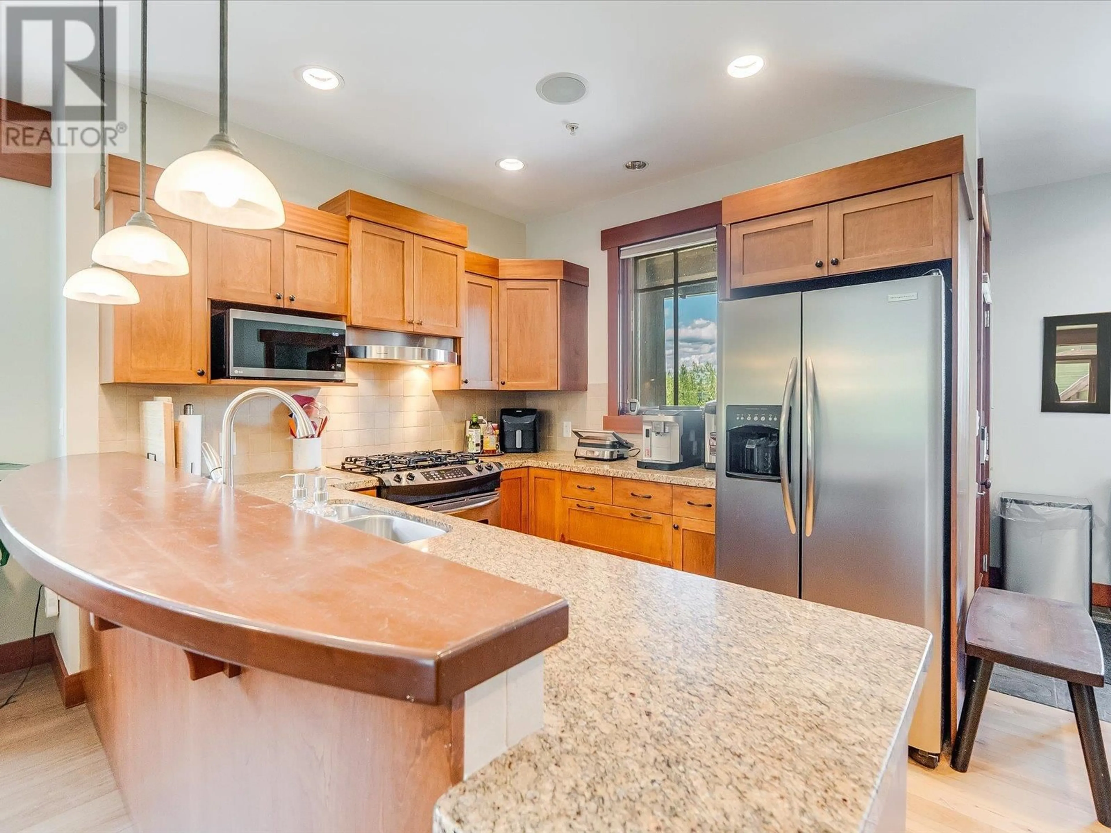 Open concept kitchen, ceramic/tile floor for A - 1002 CREEKSIDE TERRACE, Rossland British Columbia V0G1Y0