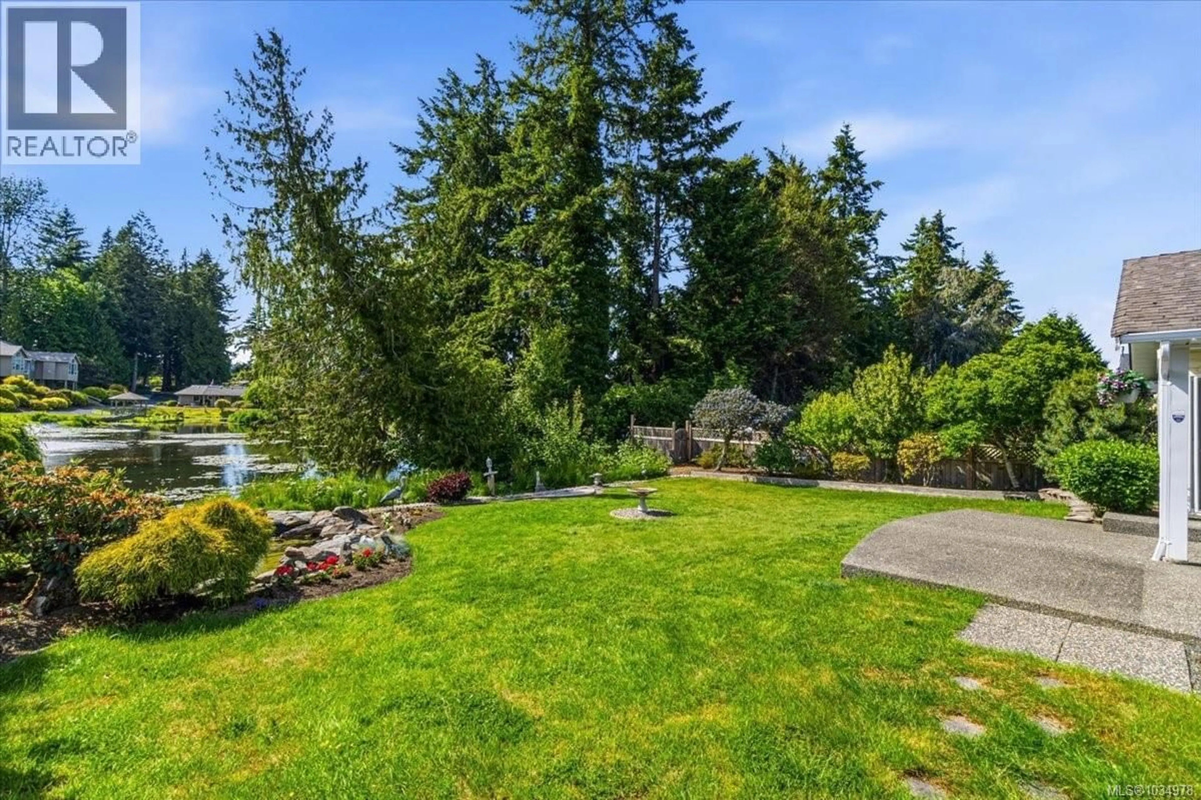 A pic from outside/outdoor area/front of a property/back of a property/a pic from drone, water/lake/river/ocean view for 518 DALMATIAN DRIVE, Parksville British Columbia V9P1Y4