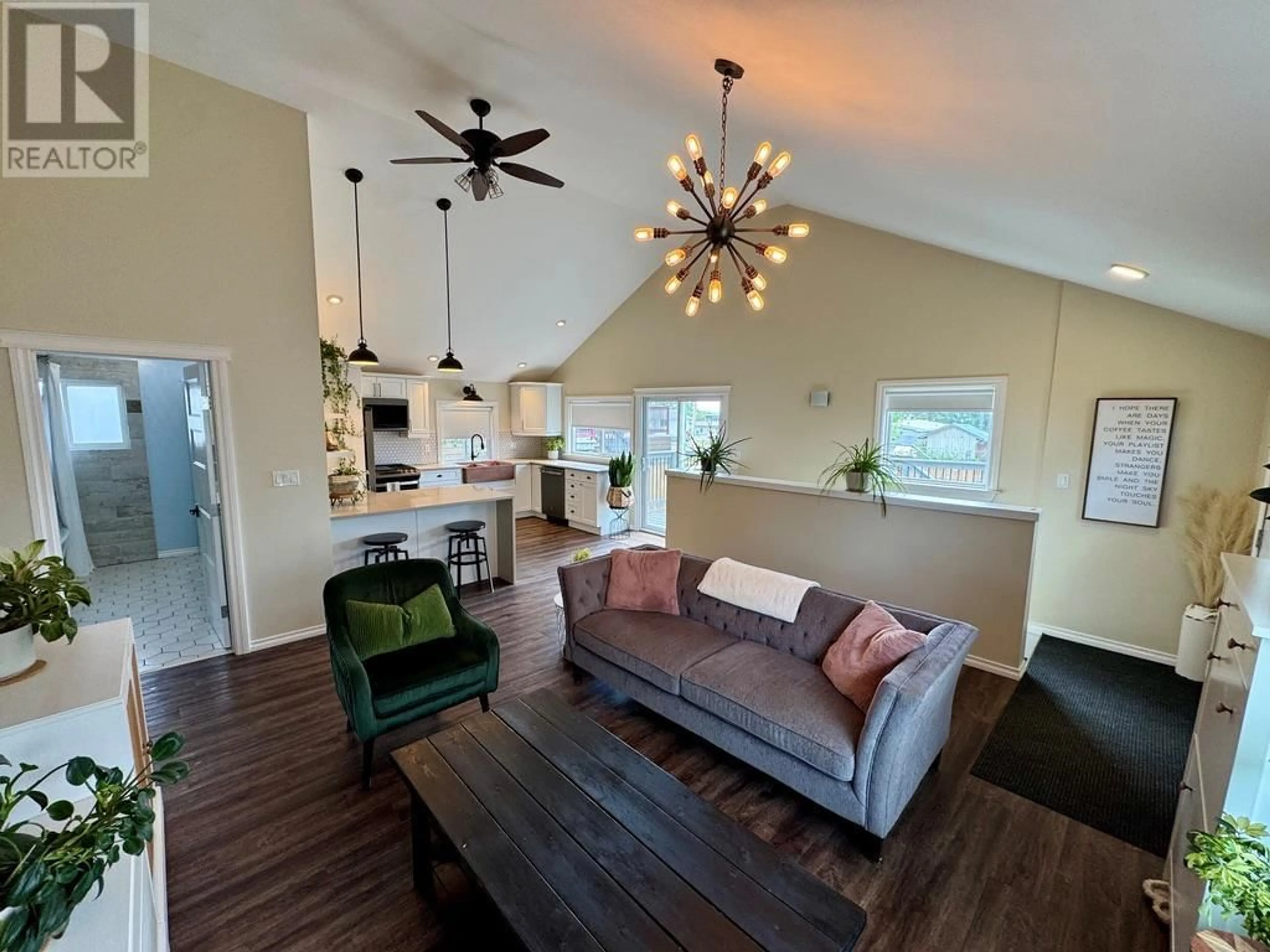 Living room with furniture, wood/laminate floor for 305 98 AVENUE, Dawson Creek British Columbia V1G1R8