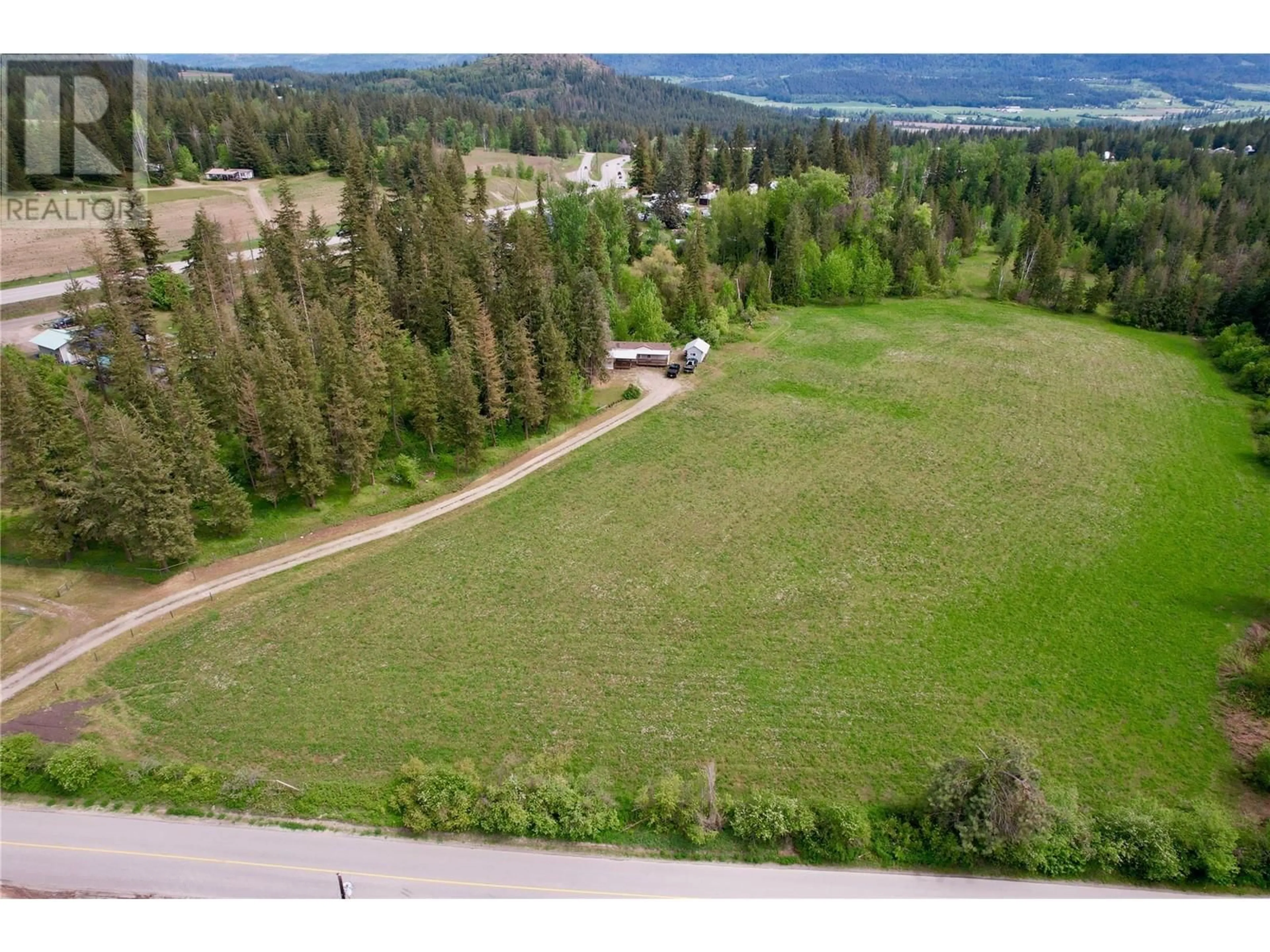 A pic from outside/outdoor area/front of a property/back of a property/a pic from drone, forest/trees view for 11 GARDOM LAKE ROAD, Enderby British Columbia V0E1V2