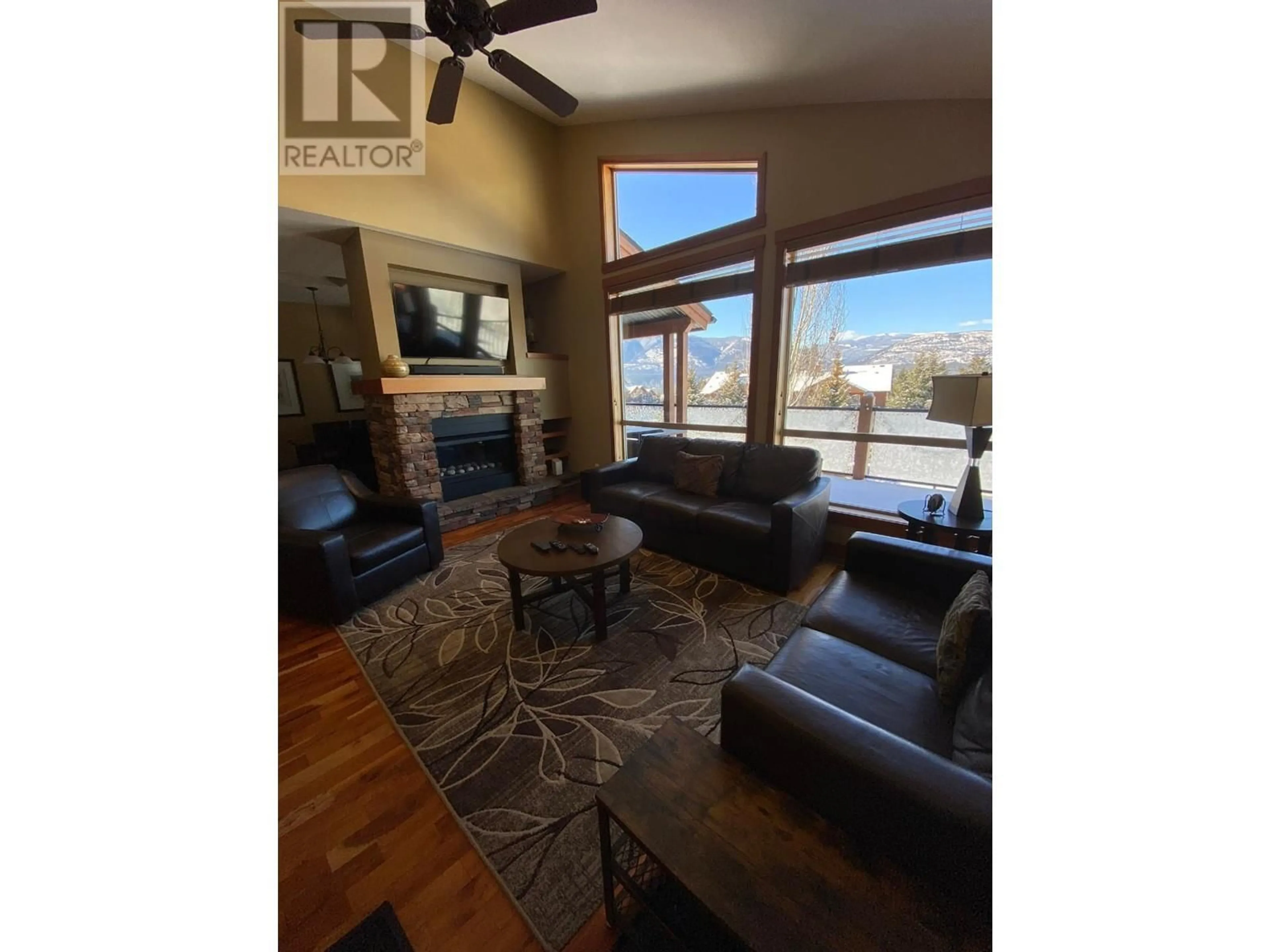 Living room with furniture, wood/laminate floor for 14 D4 - 5150 FAIRWAY DRIVE, Fairmont Hot Springs British Columbia V0B1L1