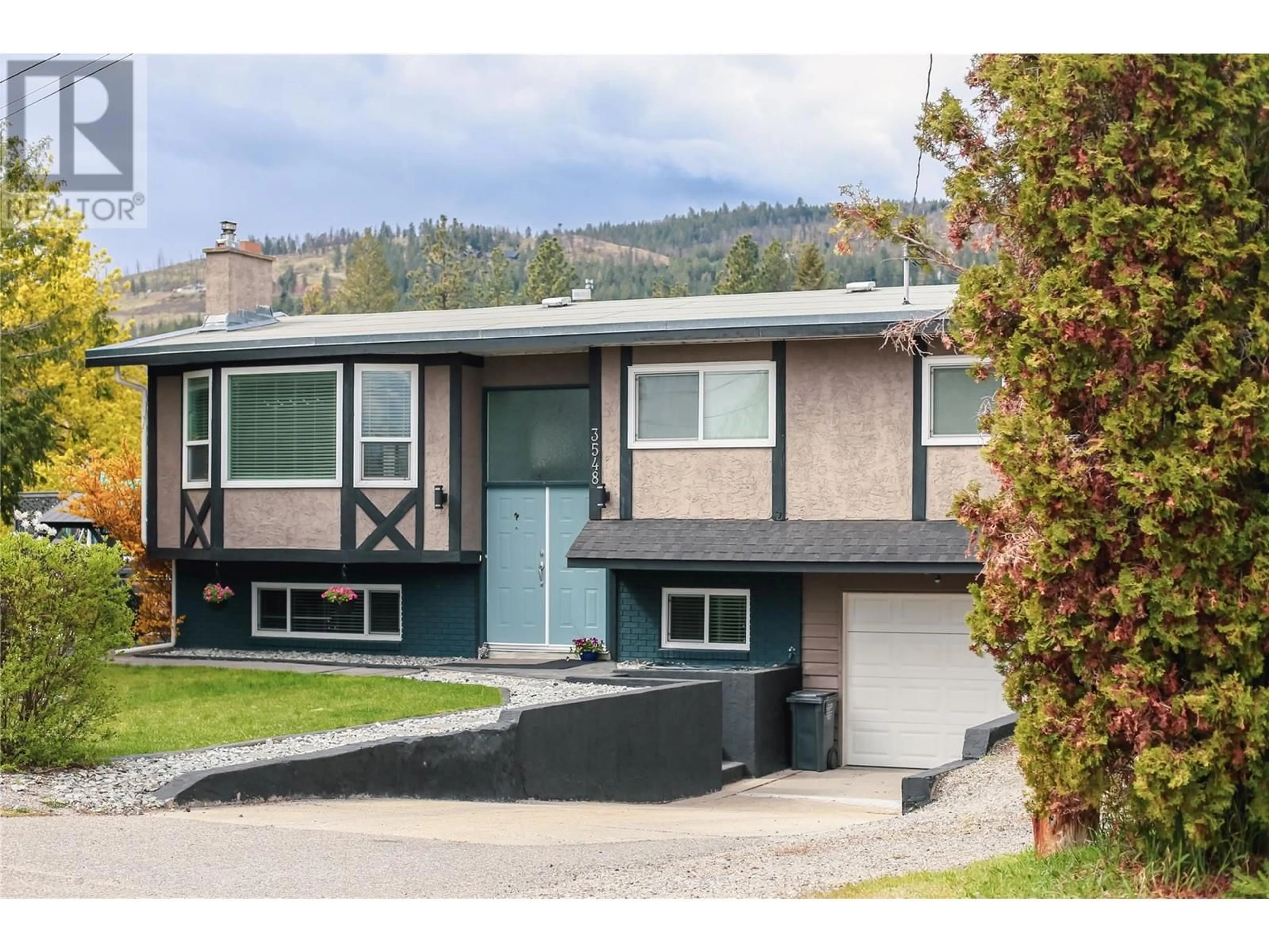 Home with vinyl exterior material, street for 3548 MACDONNEL ROAD, West Kelowna British Columbia V4T1J1