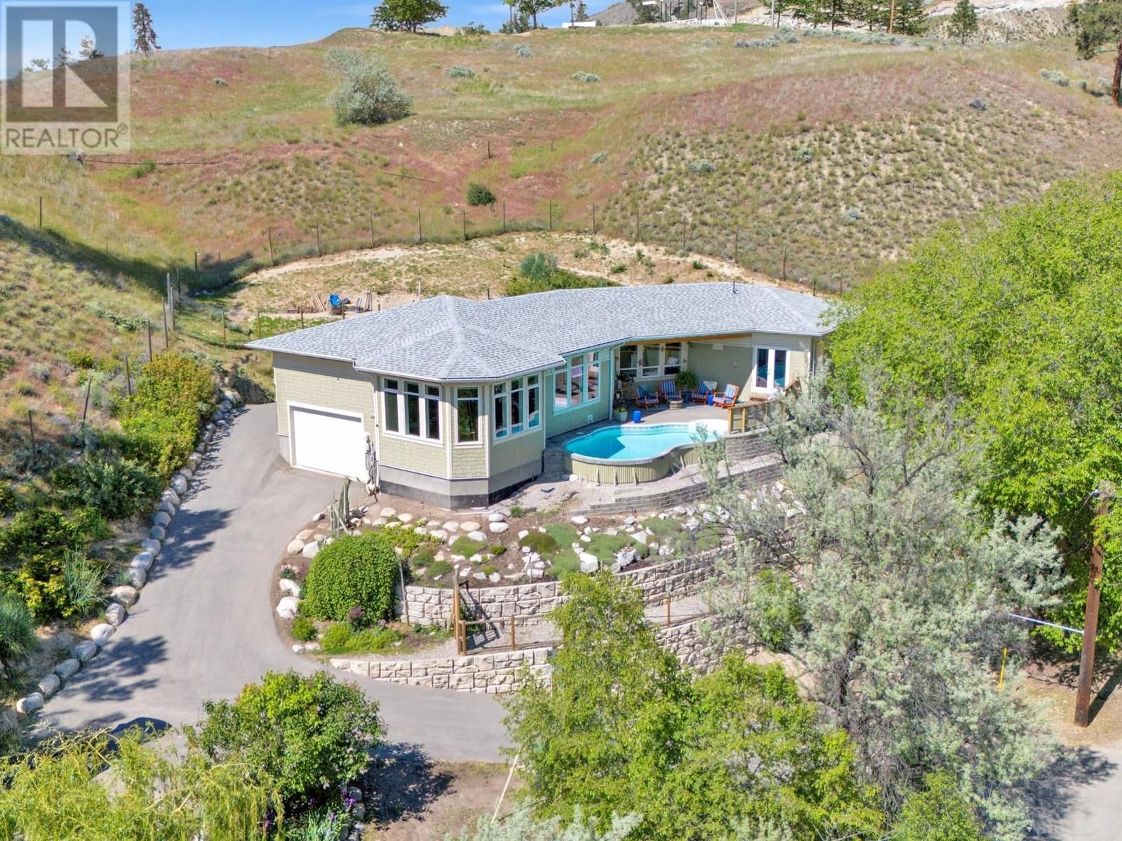 A pic from outside/outdoor area/front of a property/back of a property/a pic from drone, mountain view for 153 SMYTHE DRIVE, Penticton British Columbia V2A8W6