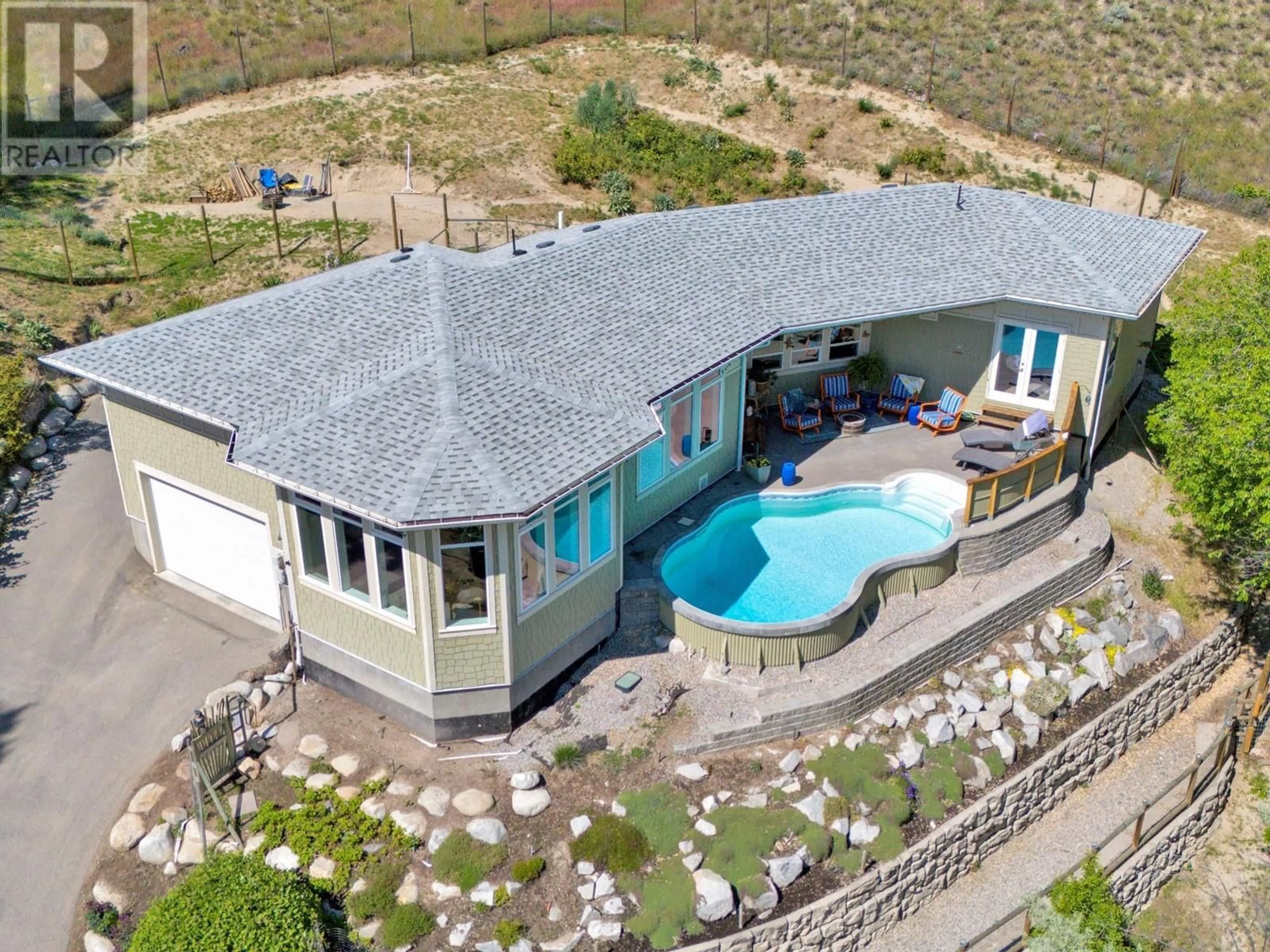 A pic from outside/outdoor area/front of a property/back of a property/a pic from drone, unknown for 153 SMYTHE DRIVE, Penticton British Columbia V2A8W6