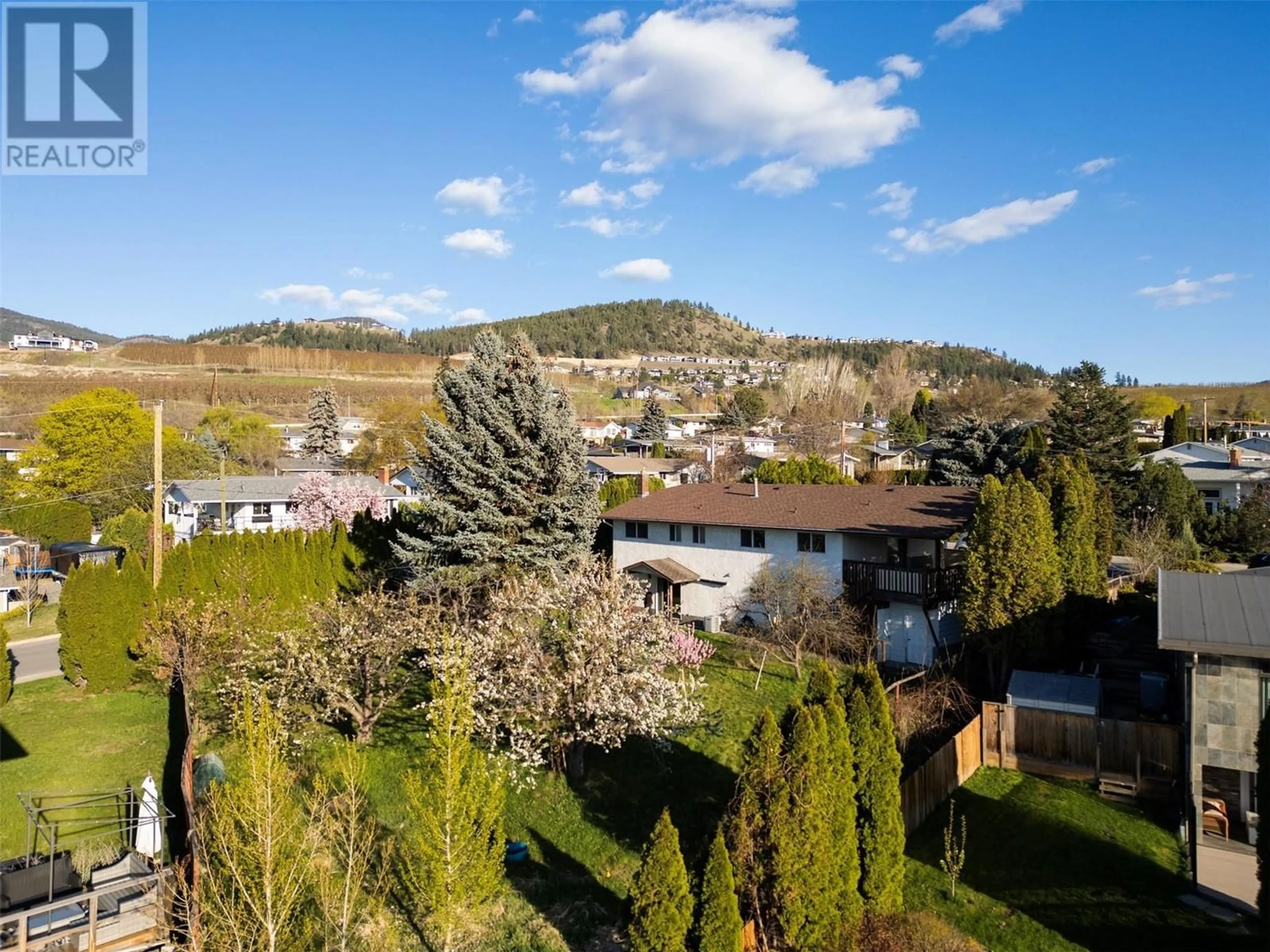 A pic from outside/outdoor area/front of a property/back of a property/a pic from drone, mountain view for 410 SEAFORD ROAD, Kelowna British Columbia V1X5L4