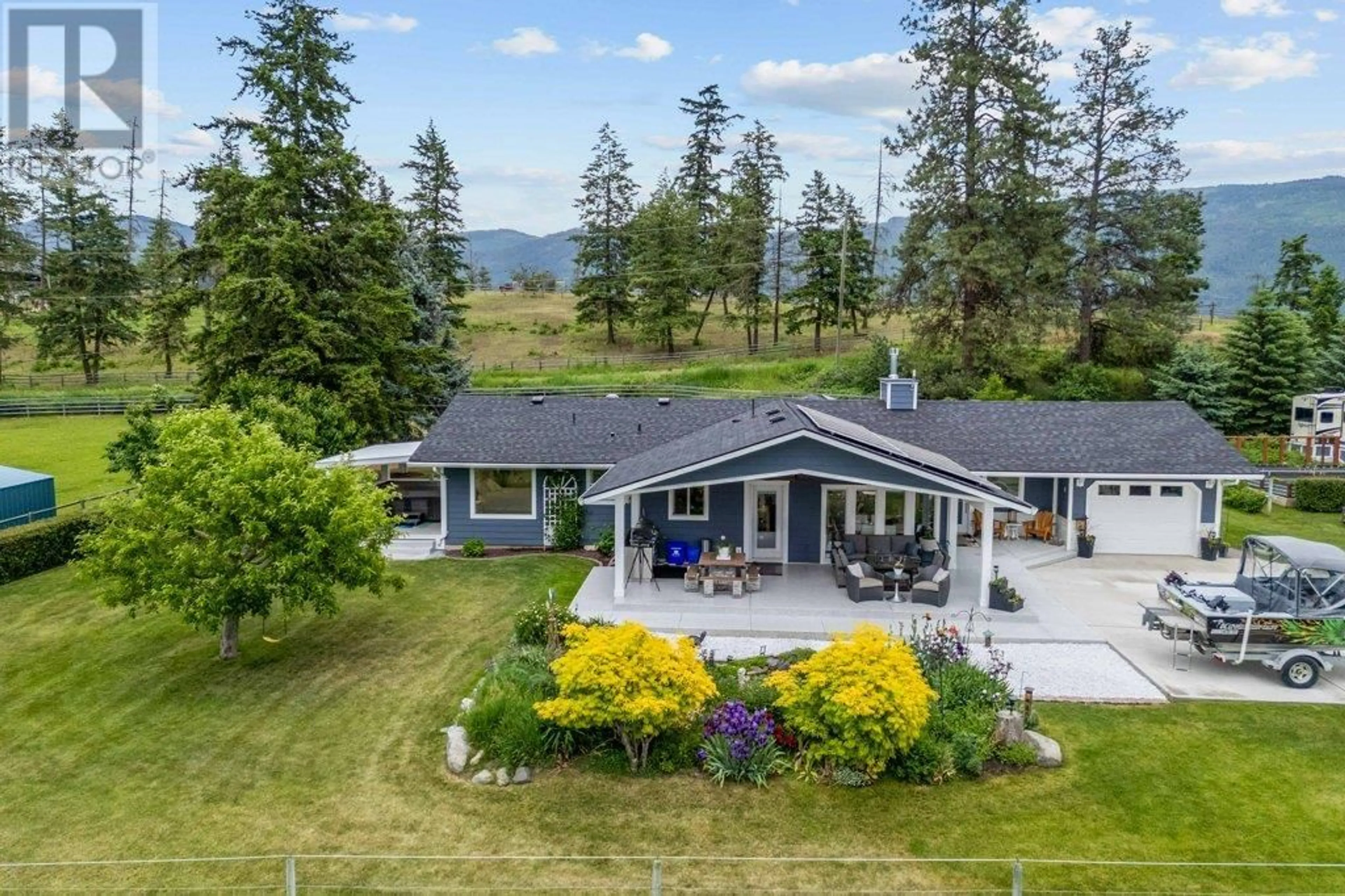 A pic from outside/outdoor area/front of a property/back of a property/a pic from drone, mountain view for 4911 MALPASS ROAD, Armstrong British Columbia V0E1B3