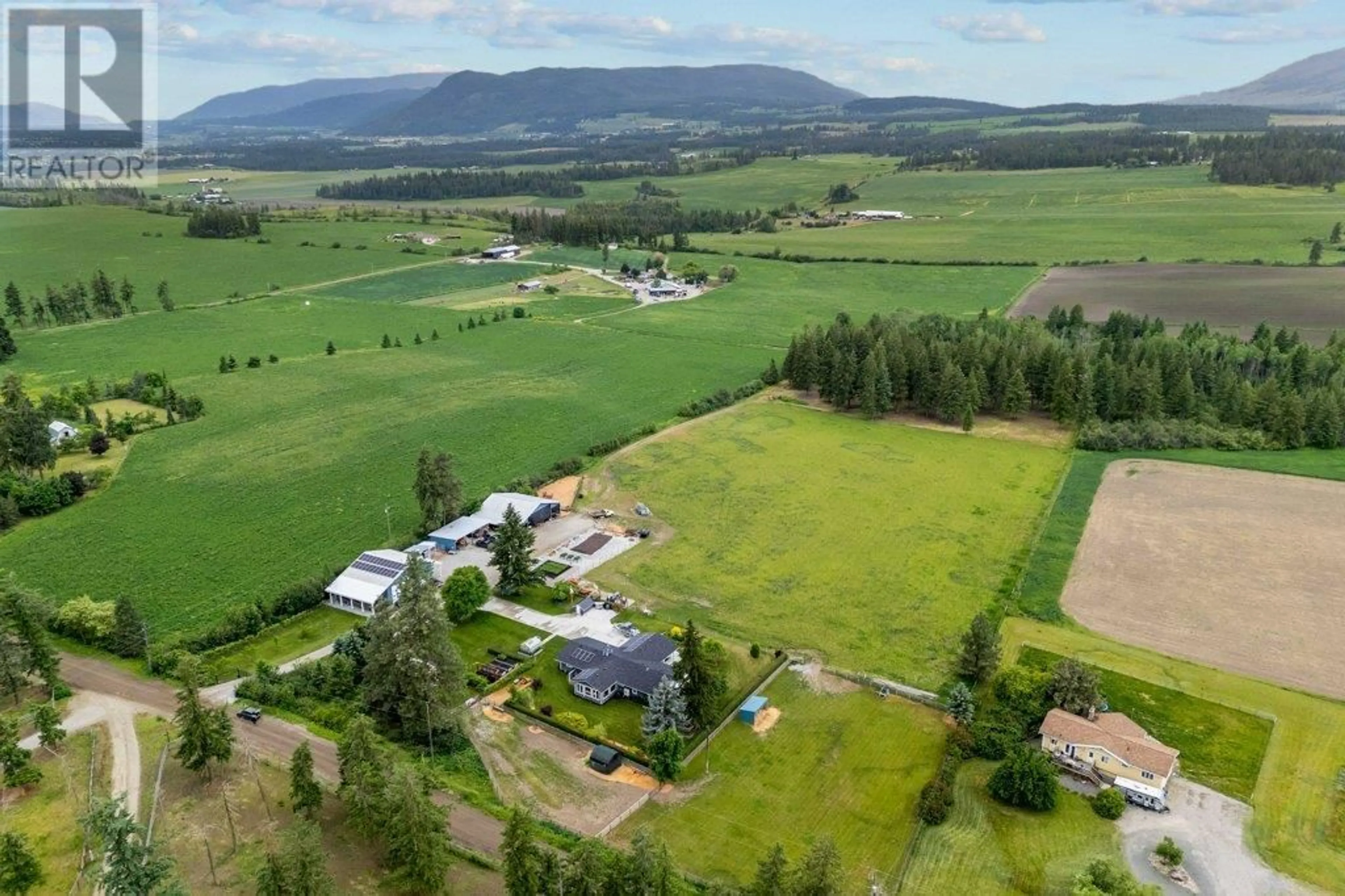 A pic from outside/outdoor area/front of a property/back of a property/a pic from drone, mountain view for 4911 MALPASS ROAD, Armstrong British Columbia V0E1B3