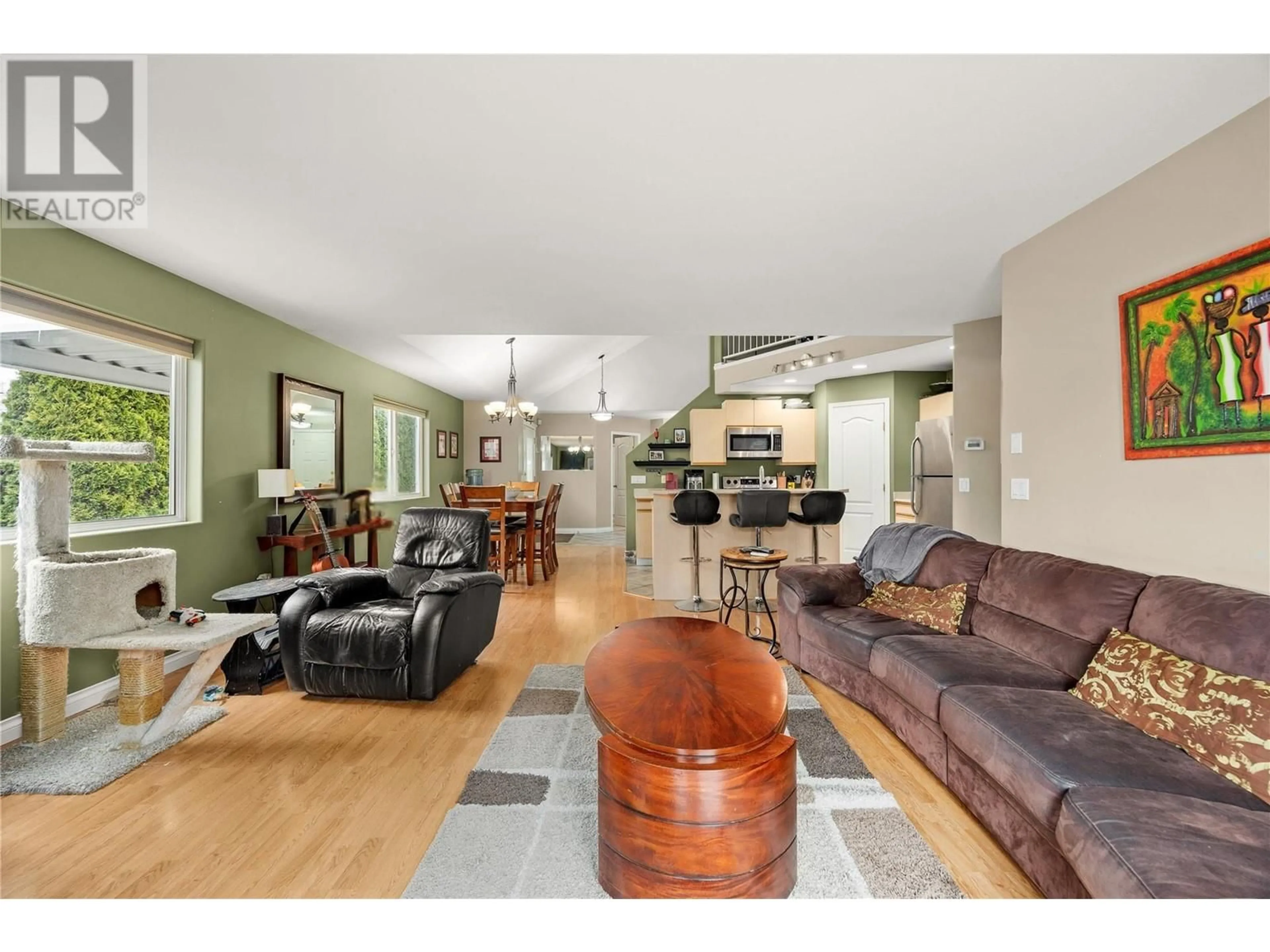 Open concept kitchen, wood/laminate floor for 100 VERNA COURT, Kelowna British Columbia V4T2G3