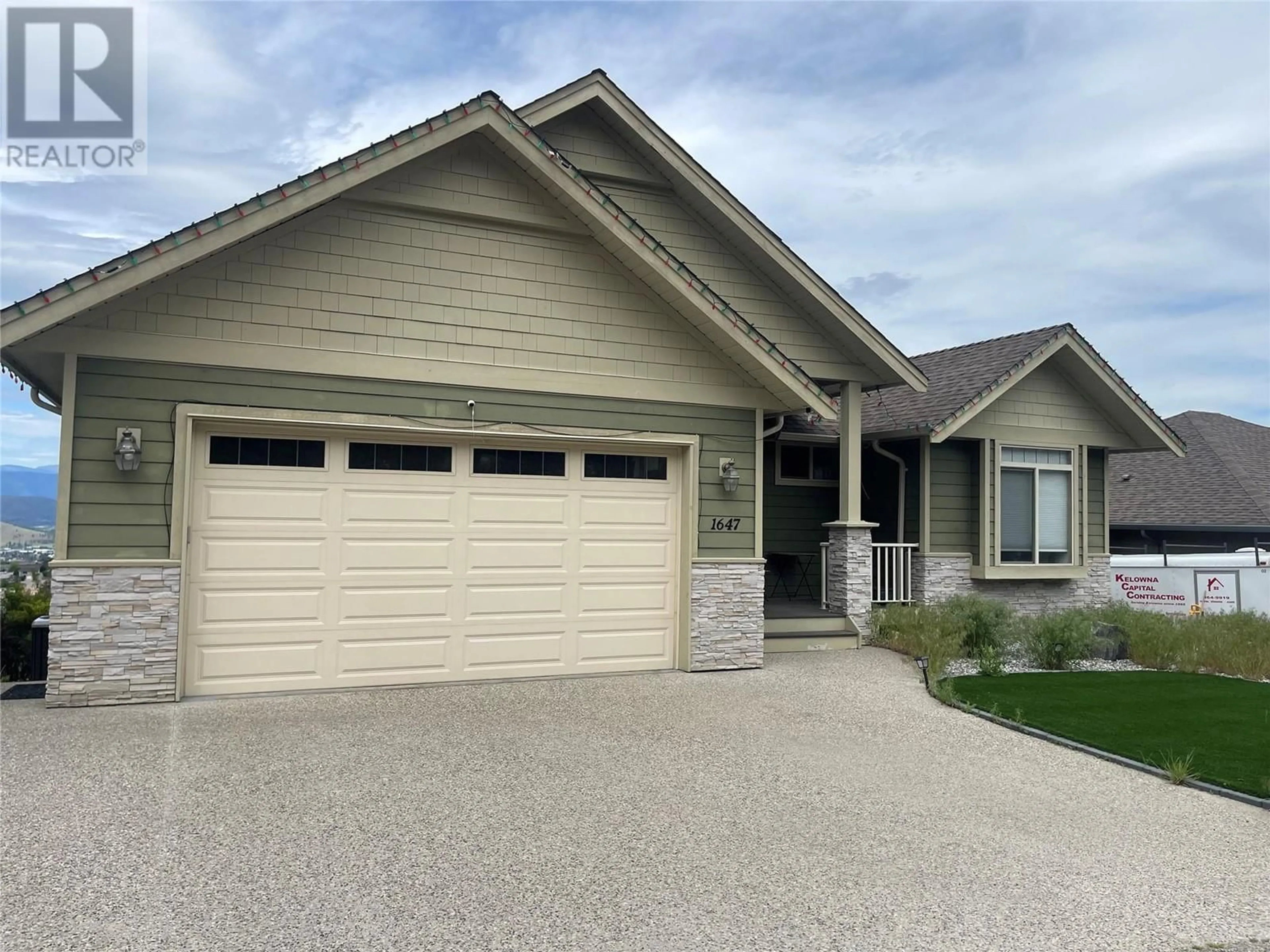 Home with vinyl exterior material, street for 1647 SUNRISE ROAD, Kelowna British Columbia V1P1N9