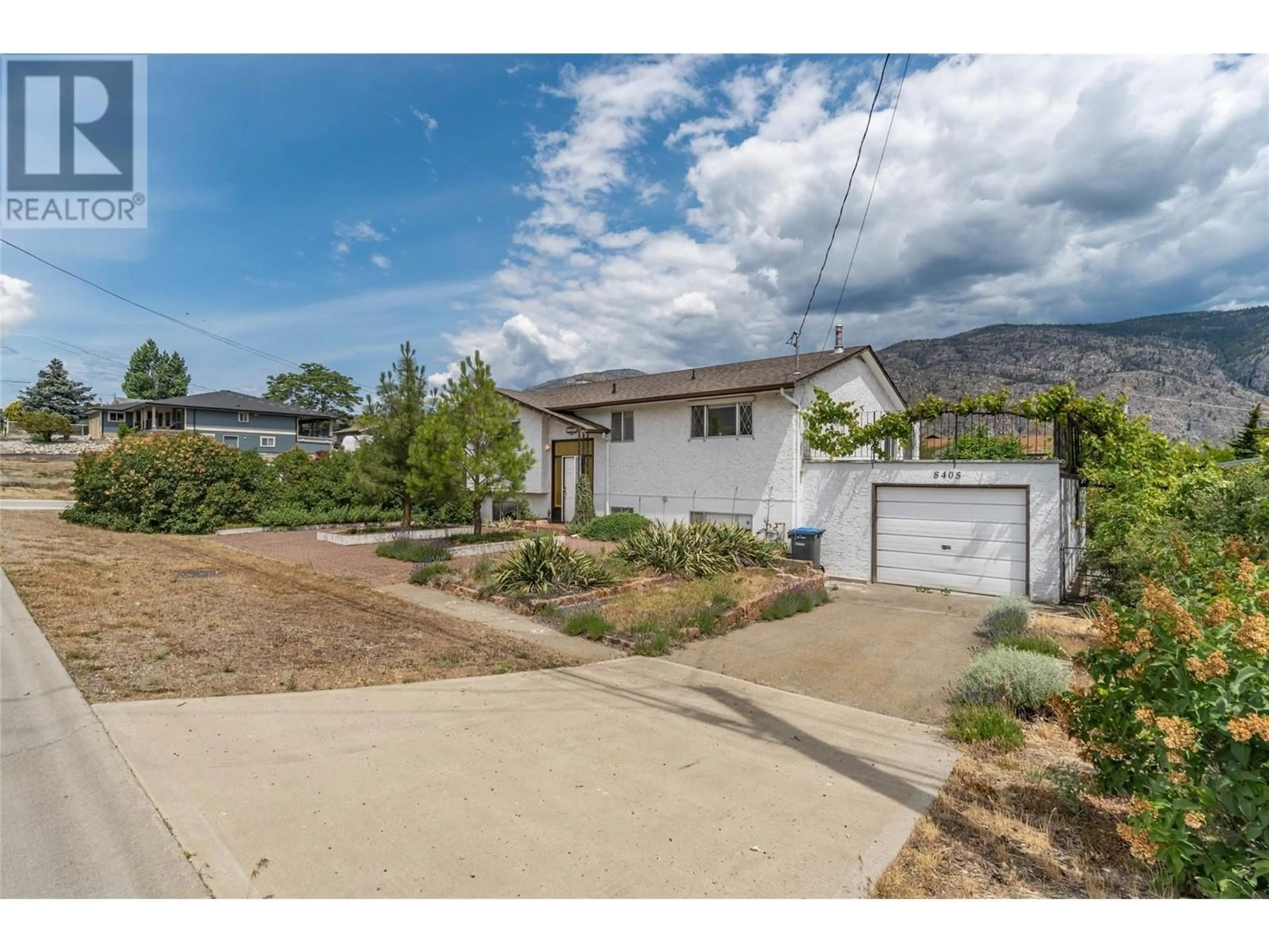 A pic from outside/outdoor area/front of a property/back of a property/a pic from drone, mountain view for 8405 87TH STREET, Osoyoos British Columbia V0H1V2