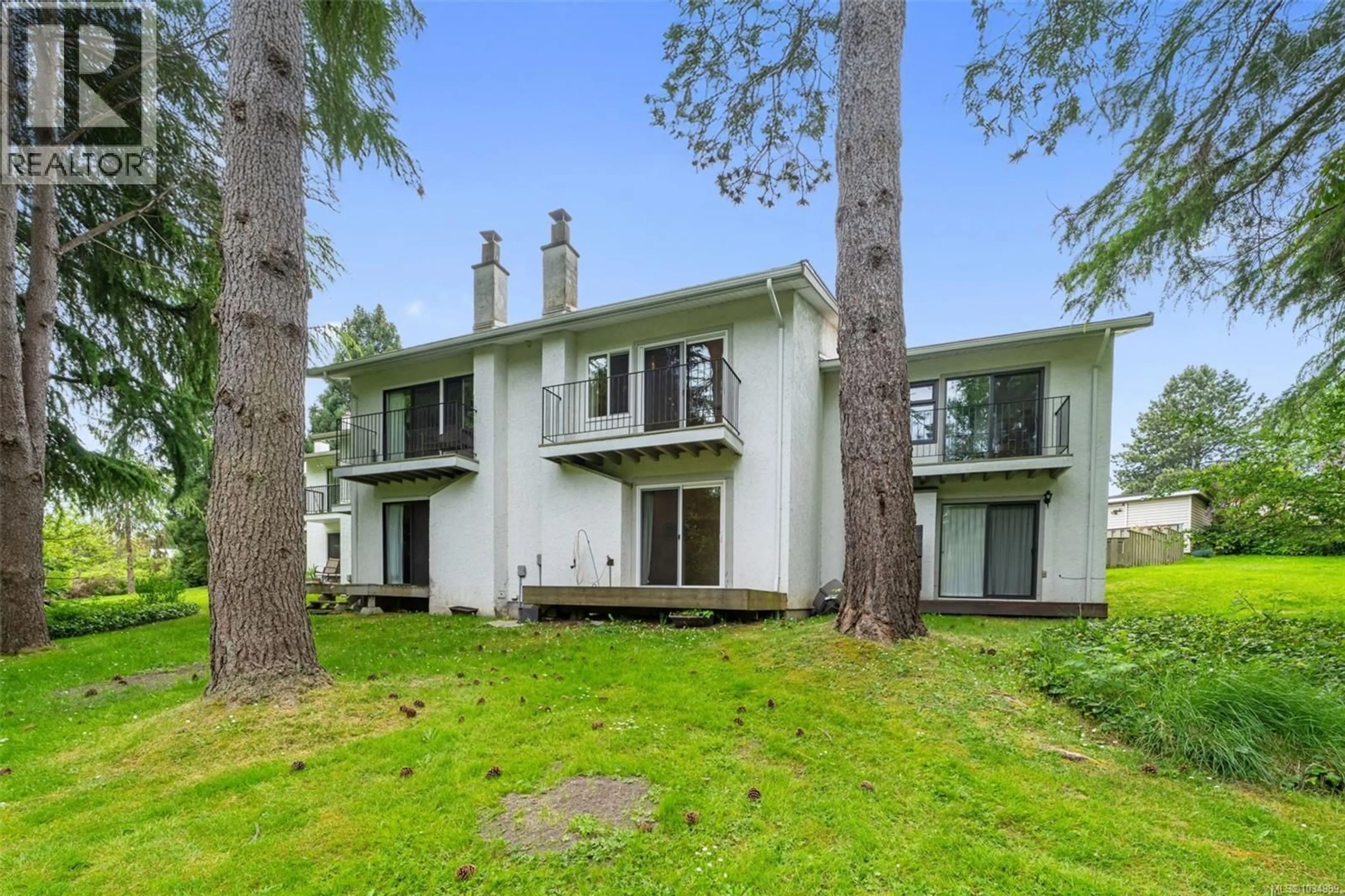 A pic from outside/outdoor area/front of a property/back of a property/a pic from drone, forest/trees view for 32 - 610 MCKENZIE AVENUE, Saanich British Columbia V8Z2A7