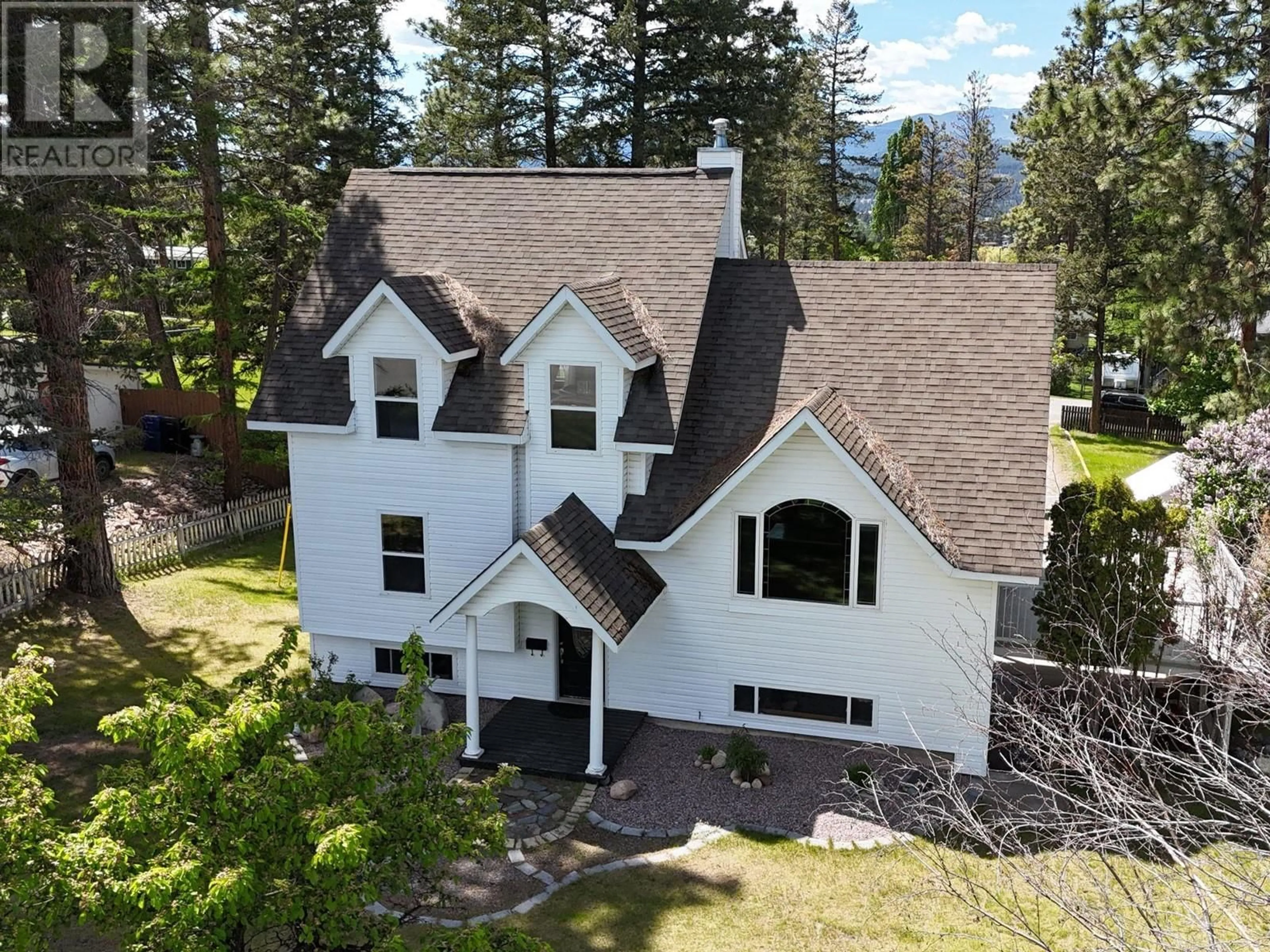 A pic from outside/outdoor area/front of a property/back of a property/a pic from drone, mountain view for 405 30TH AVENUE SOUTH, Cranbrook British Columbia V1C3K8