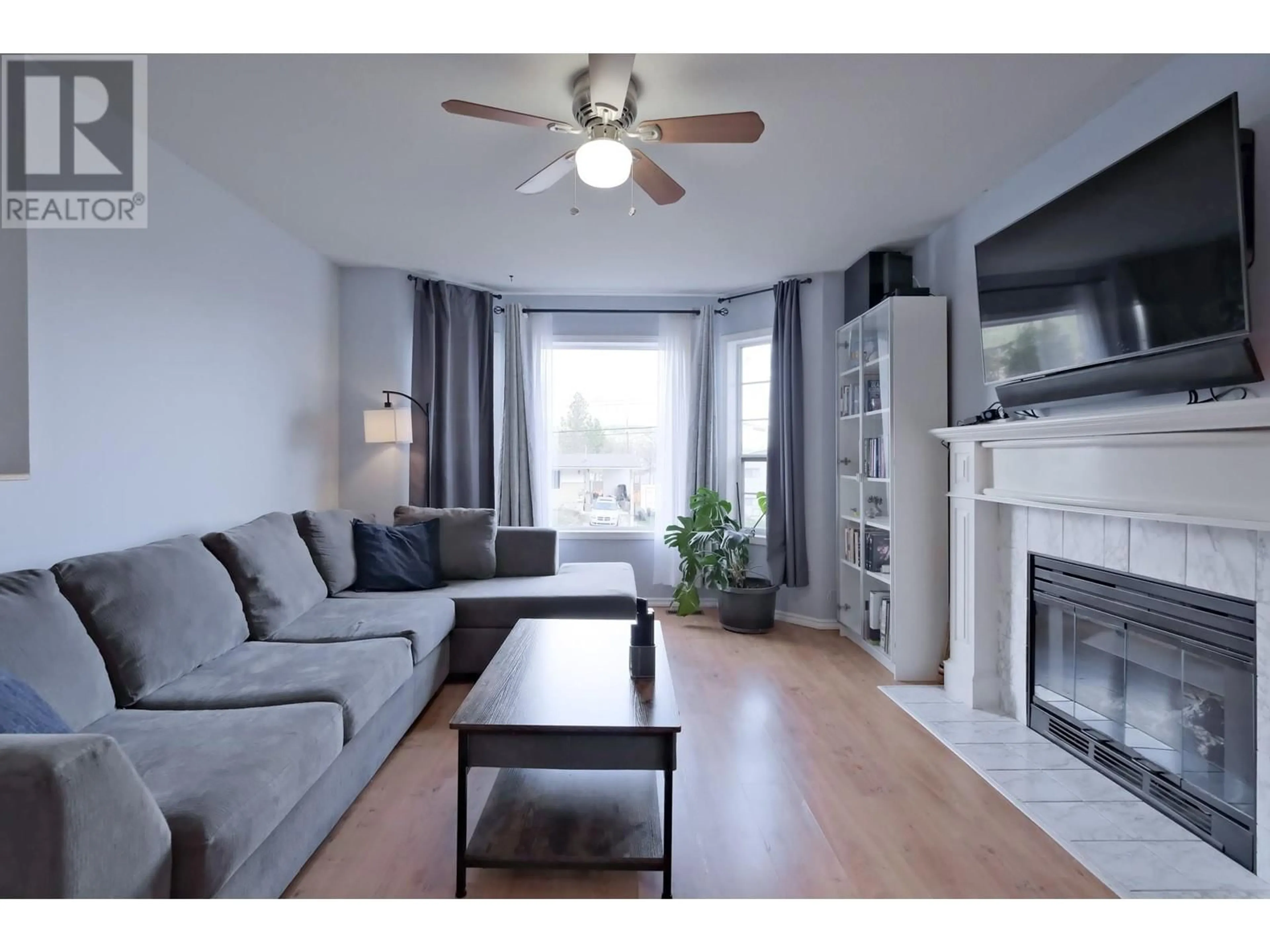 Living room with furniture, wood/laminate floor for 3270 MCGINNIS ROAD, West Kelowna British Columbia V4T1A9