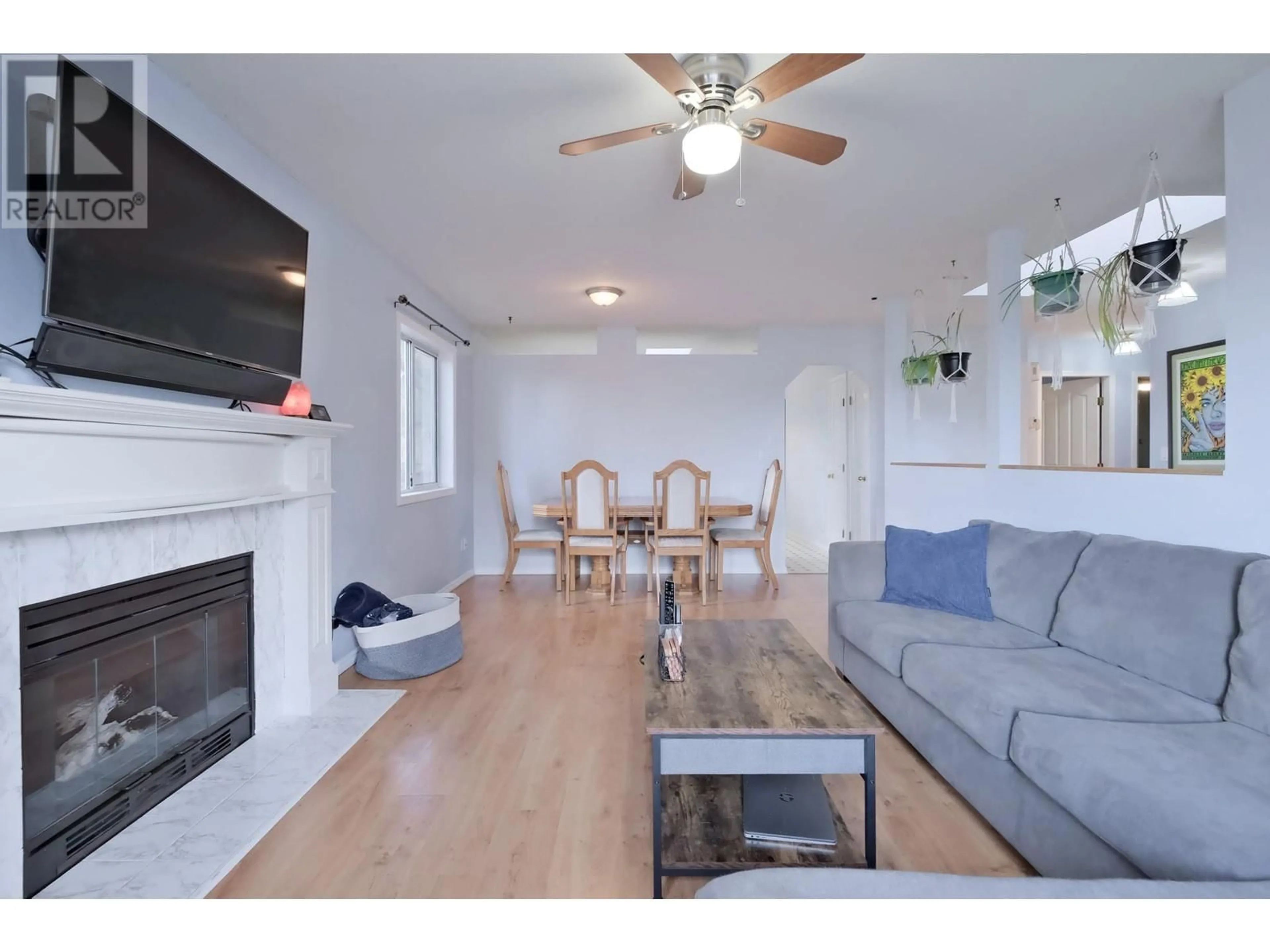 Living room with furniture, wood/laminate floor for 3270 MCGINNIS ROAD, West Kelowna British Columbia V4T1A9