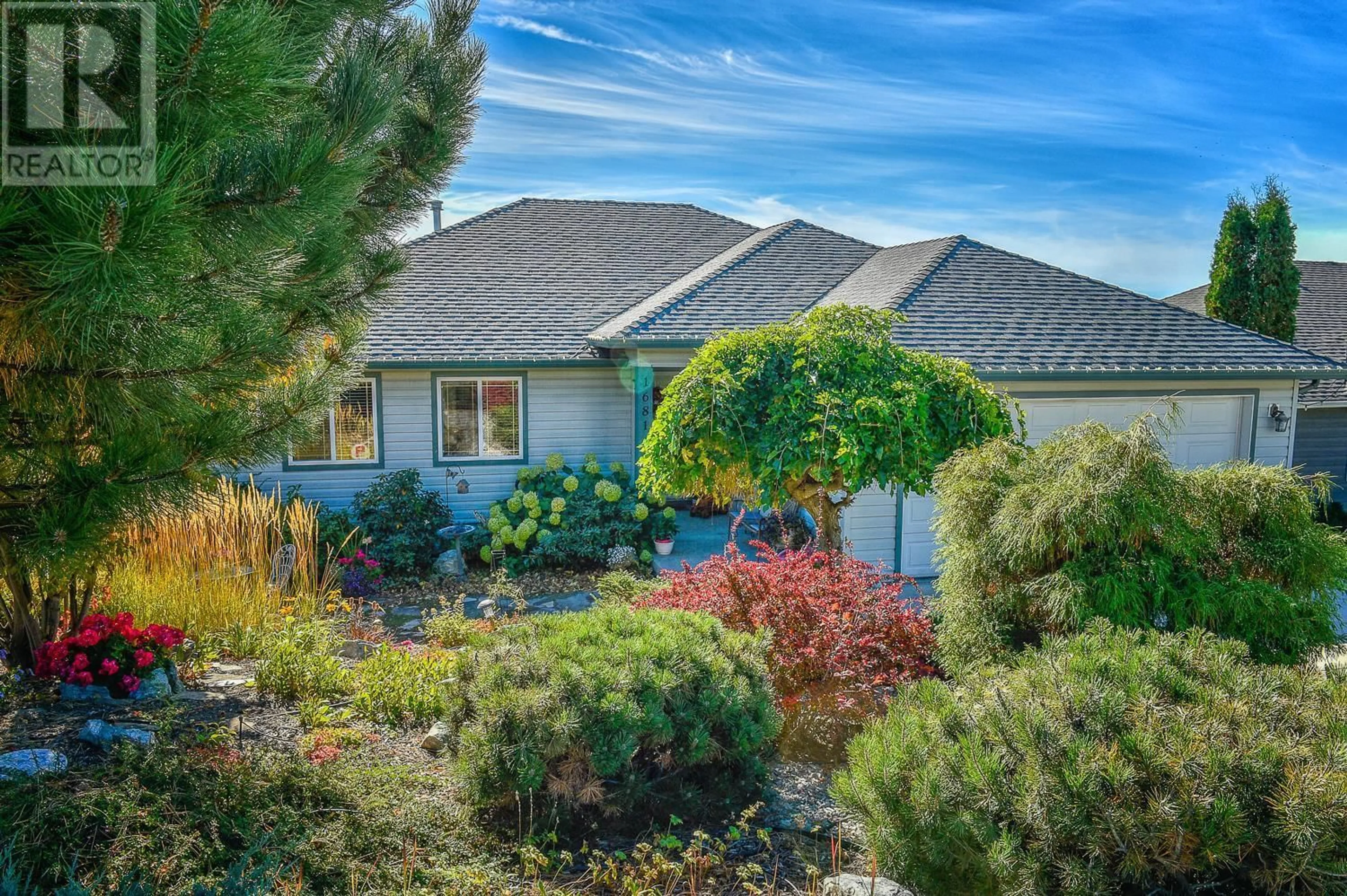 Home with vinyl exterior material, street for 1681 LARGE AVENUE, Kelowna British Columbia V1P1M9