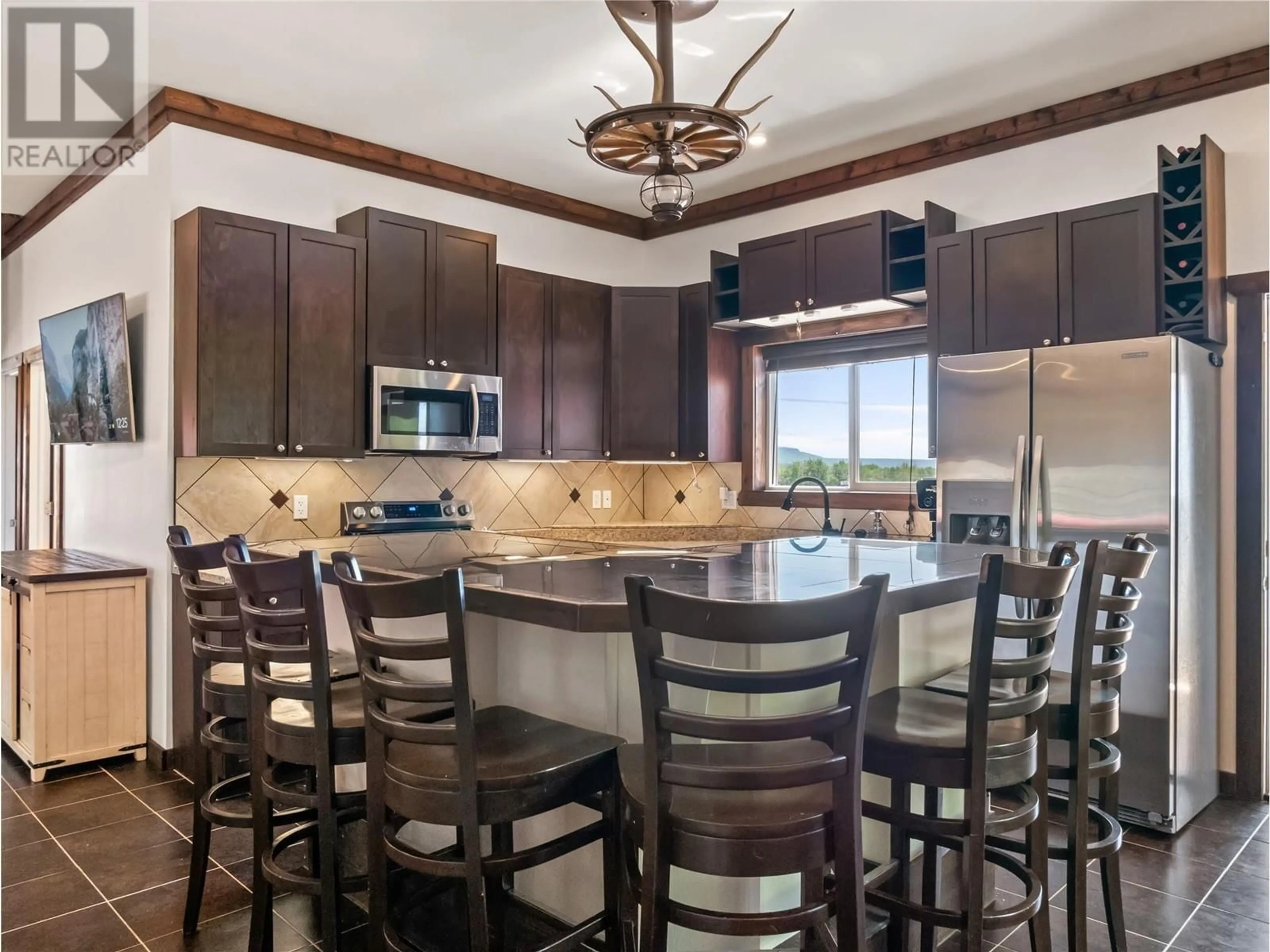 Open concept kitchen, ceramic/tile floor for 10250 239 ROAD, Dawson Creek British Columbia V1G4G3