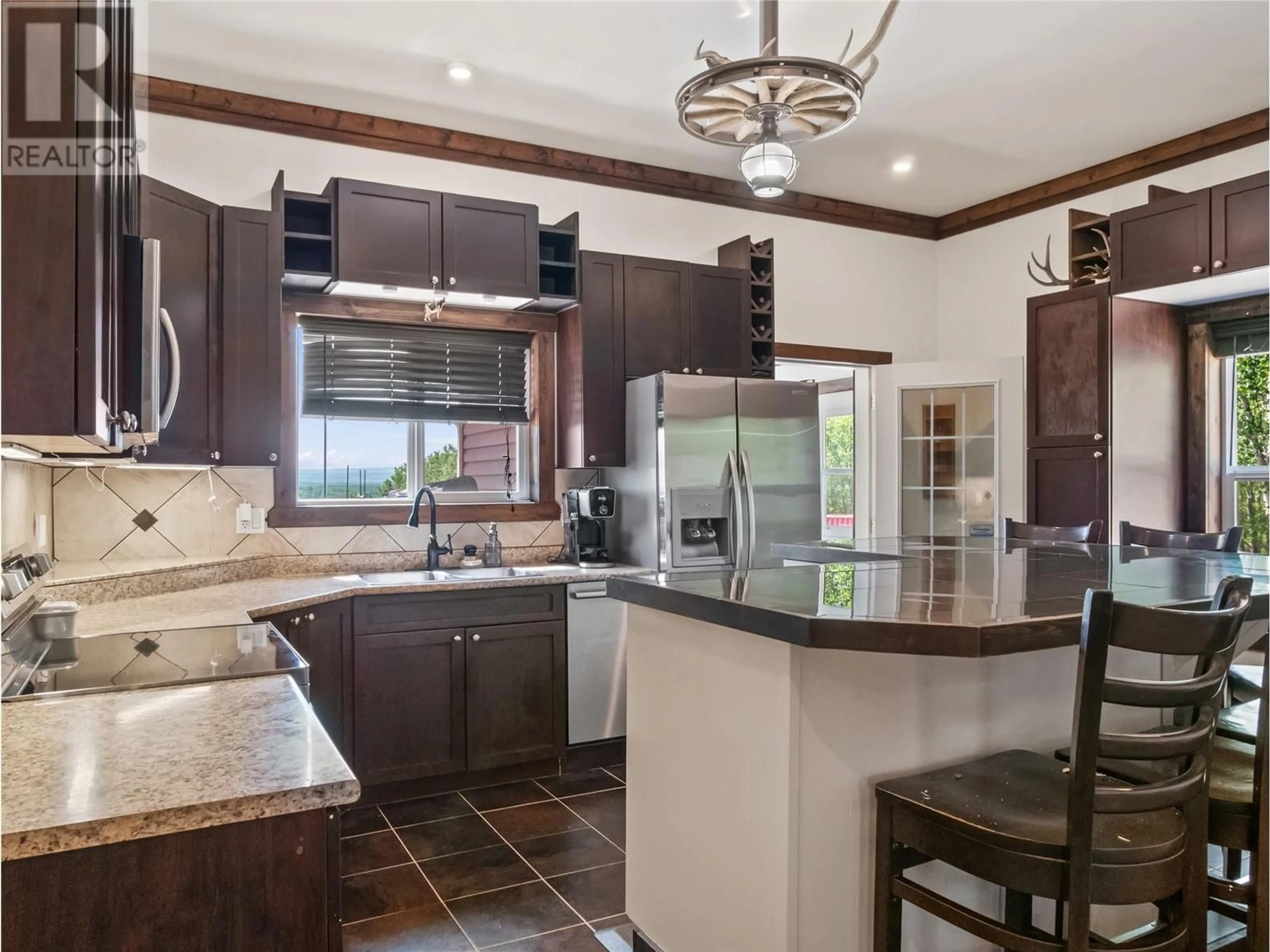 Open concept kitchen, ceramic/tile floor for 10250 239 ROAD, Dawson Creek British Columbia V1G4G3