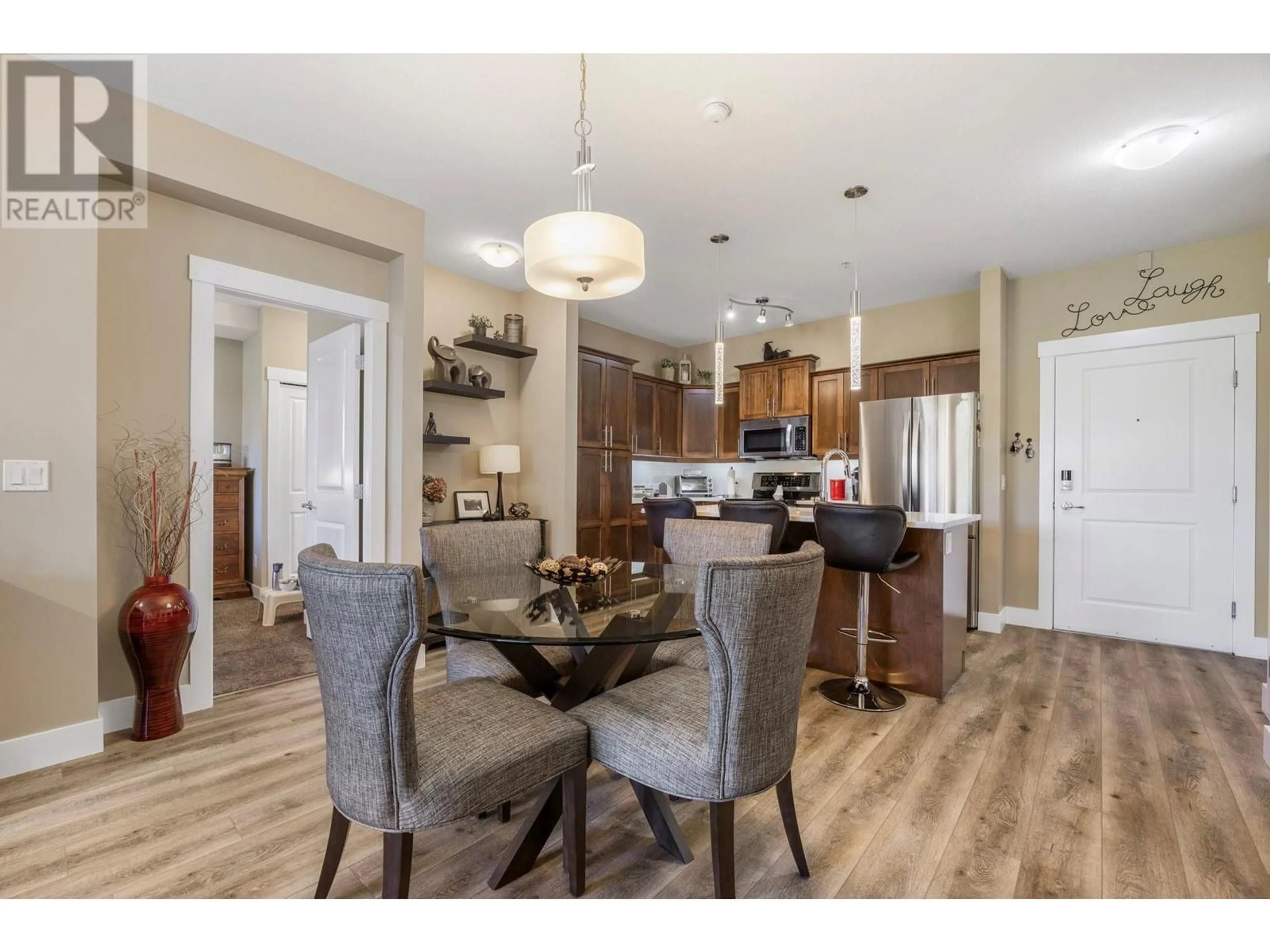 Open concept kitchen, wood/laminate floor for 102 - 3545 CARRINGTON ROAD, West Kelowna British Columbia V4T3A9