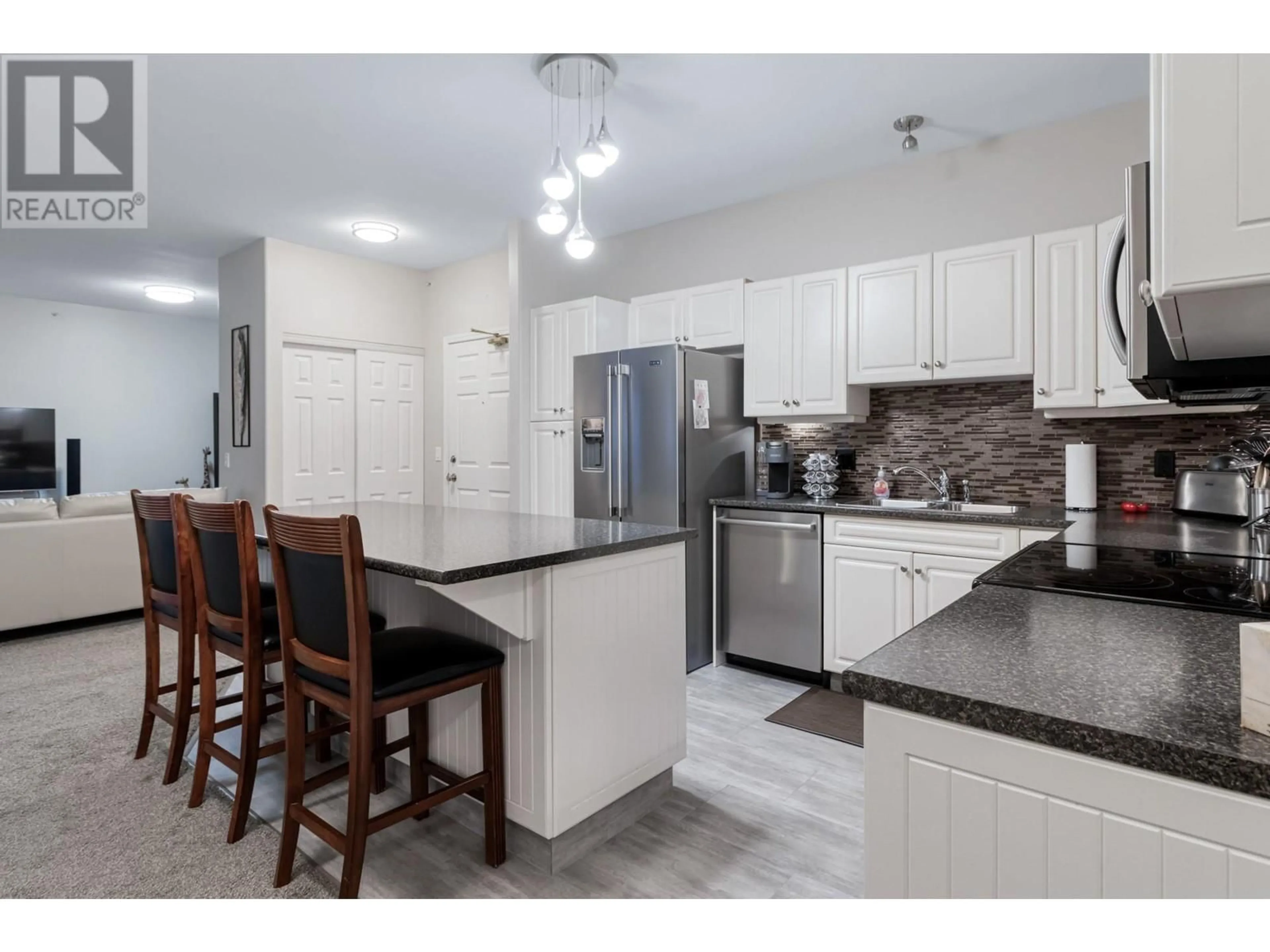 Open concept kitchen, ceramic/tile floor for 407 - 1950 DURNIN ROAD, Kelowna British Columbia V1X7W6