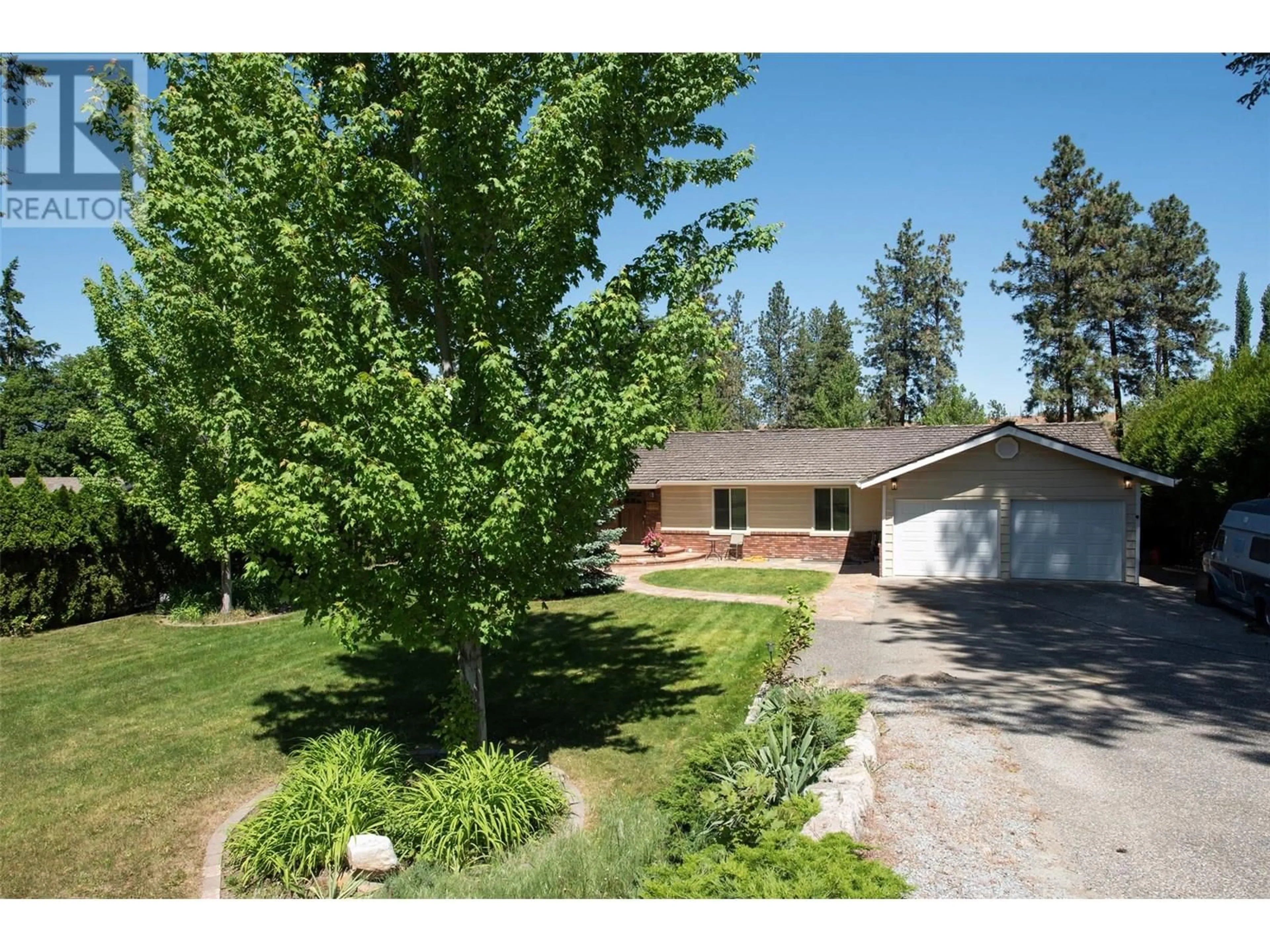 A pic from outside/outdoor area/front of a property/back of a property/a pic from drone, street for 1440 MISSION RIDGE DRIVE, Kelowna British Columbia V1W3B1
