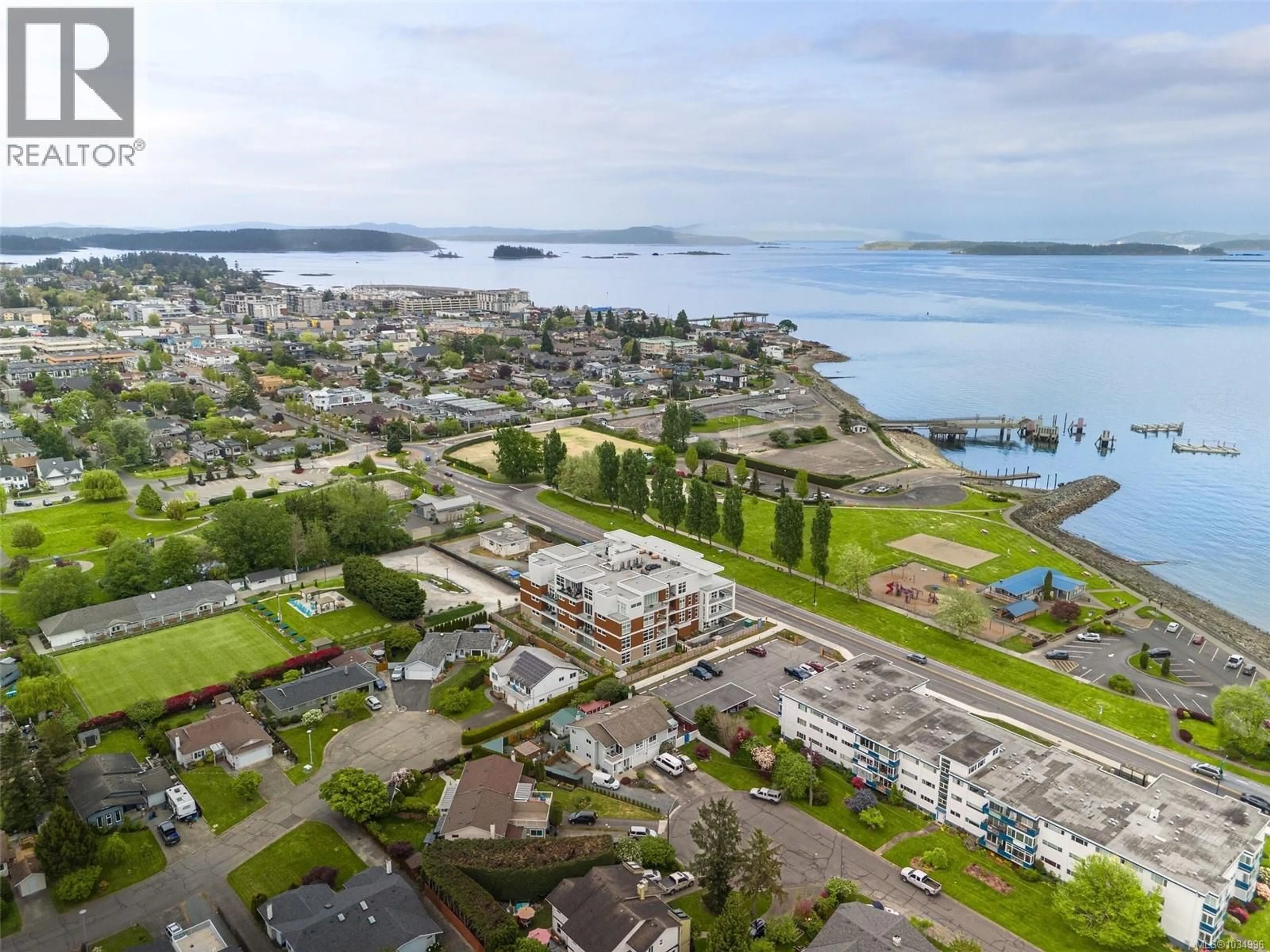 A pic from outside/outdoor area/front of a property/back of a property/a pic from drone, water/lake/river/ocean view for 203 - 9570 FIFTH STREET, Sidney British Columbia V8L2W5
