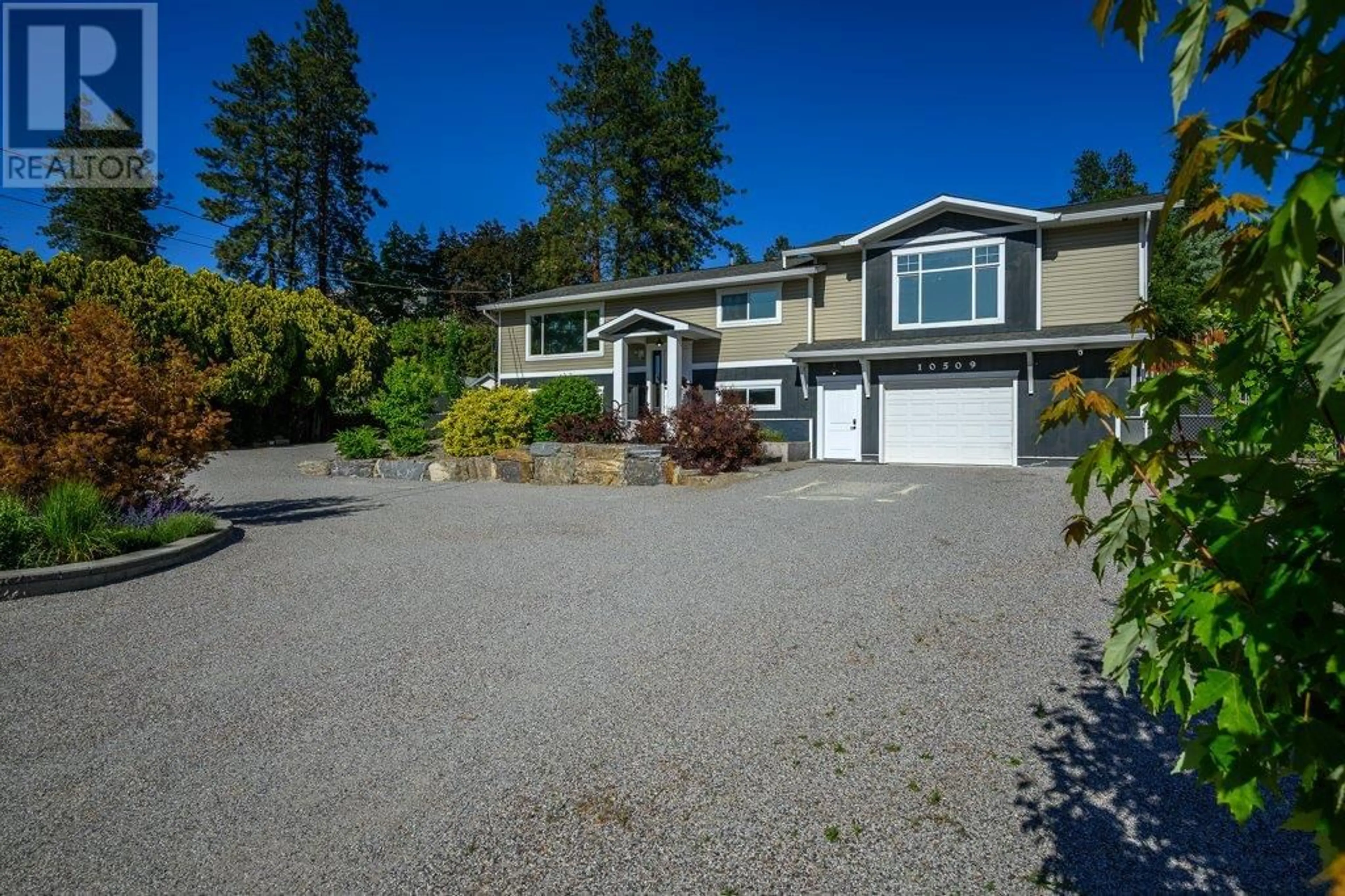 A pic from outside/outdoor area/front of a property/back of a property/a pic from drone, water/lake/river/ocean view for 10509 SHERMAN DRIVE, Lake Country British Columbia V4V1W2